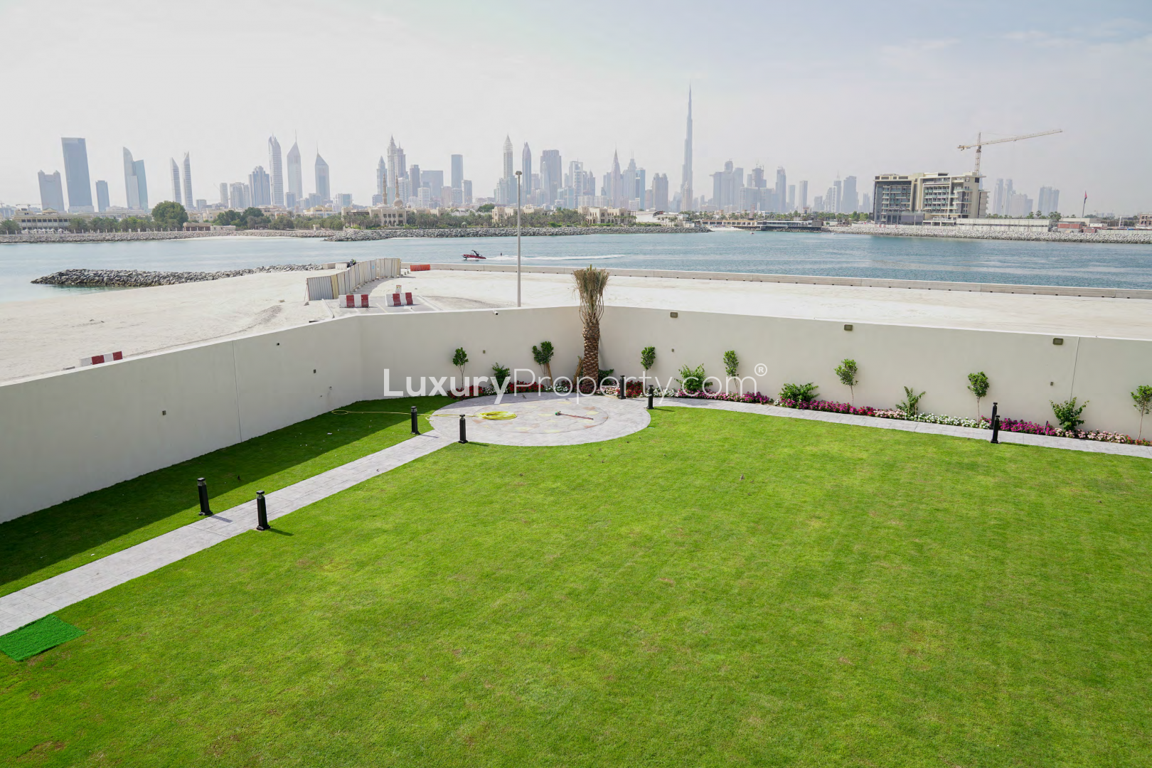 Modern 6-bedroom villa exterior with garden in Pearl Jumeirah, Dubai, for sale