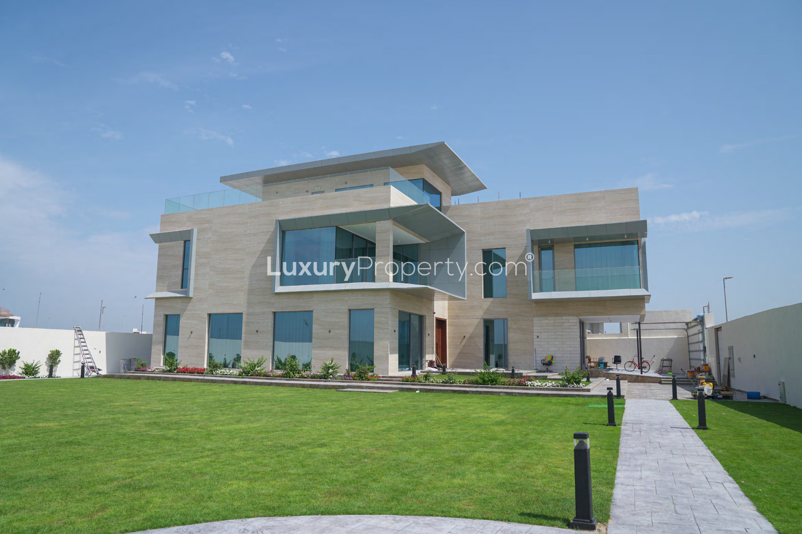 Expansive garden with sea and downtown skyline views at Pearl Jumeirah villa