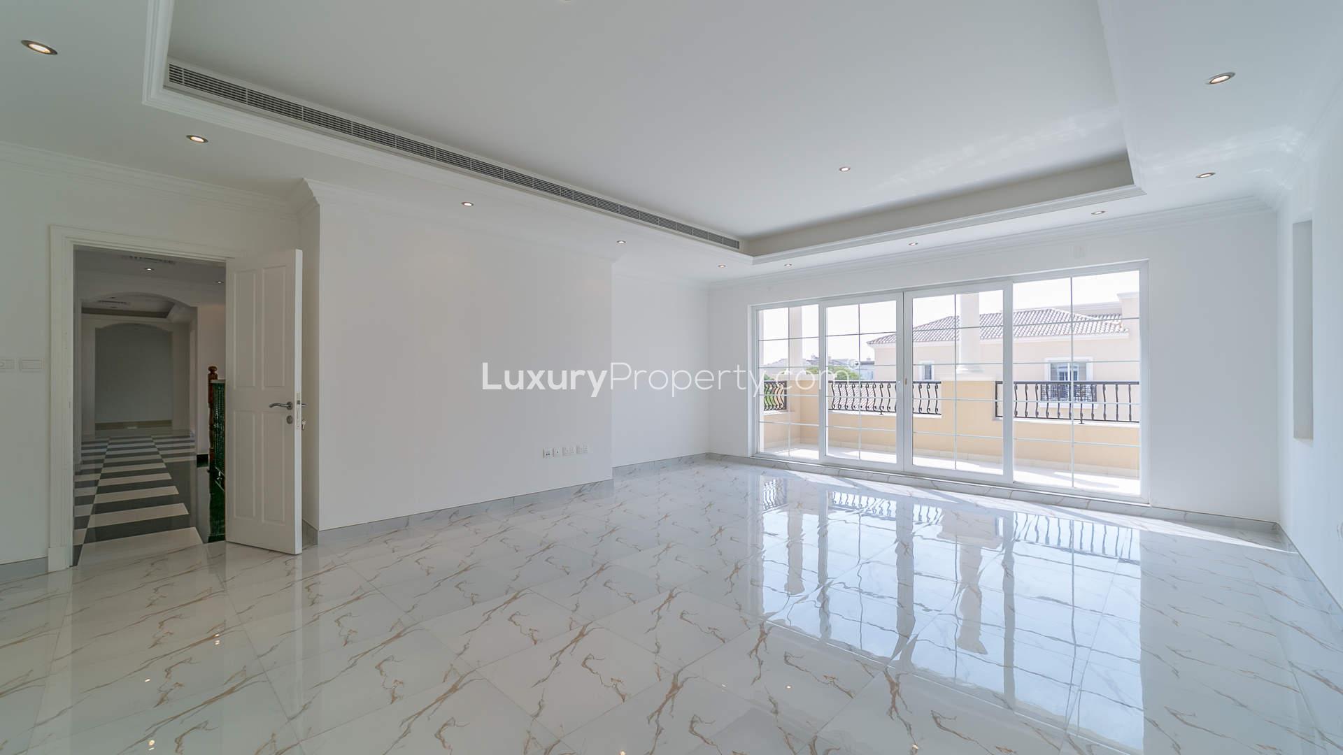 Luxurious bathroom in six-bedroom villa, Polo Homes, Arabian Ranches, featuring elegant freestanding tub