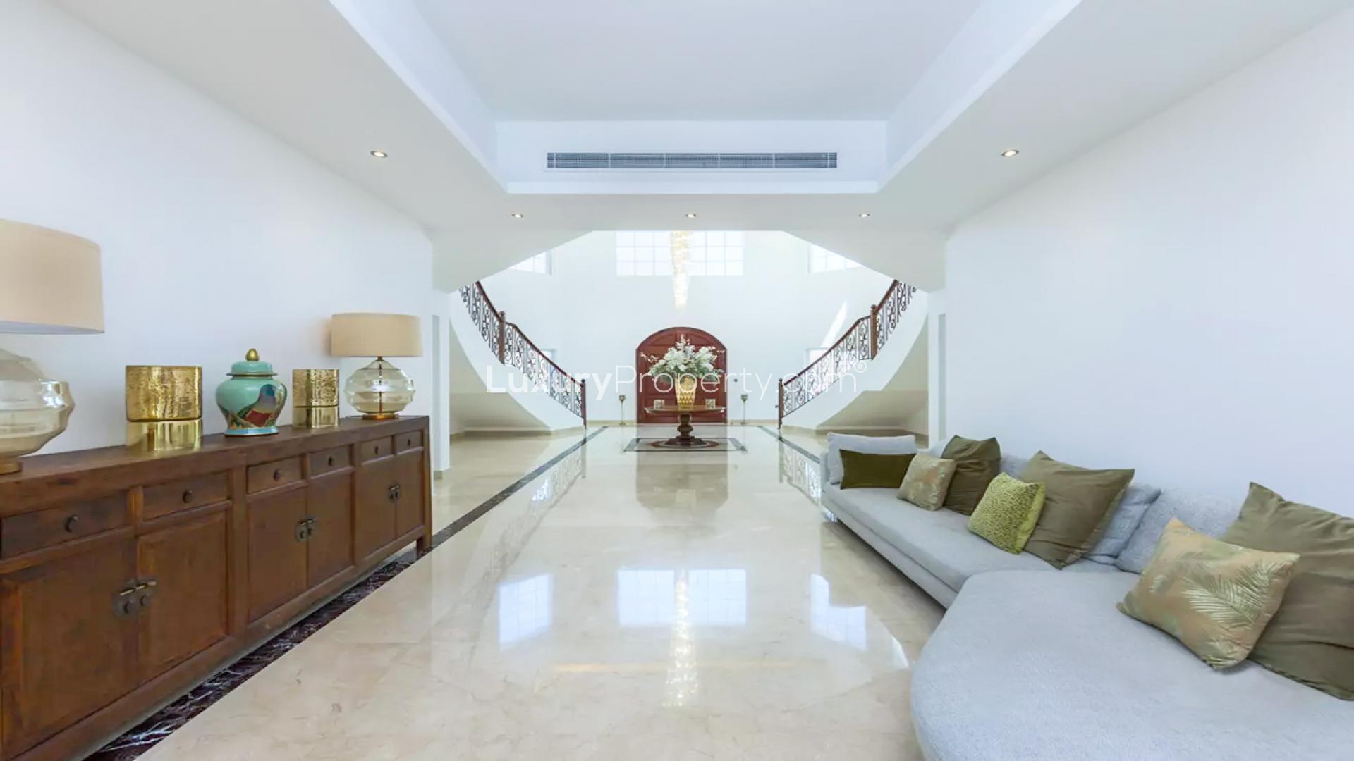 Elegant foyer with grand staircase in luxury Polo Home, Arabian Ranches villa for sale