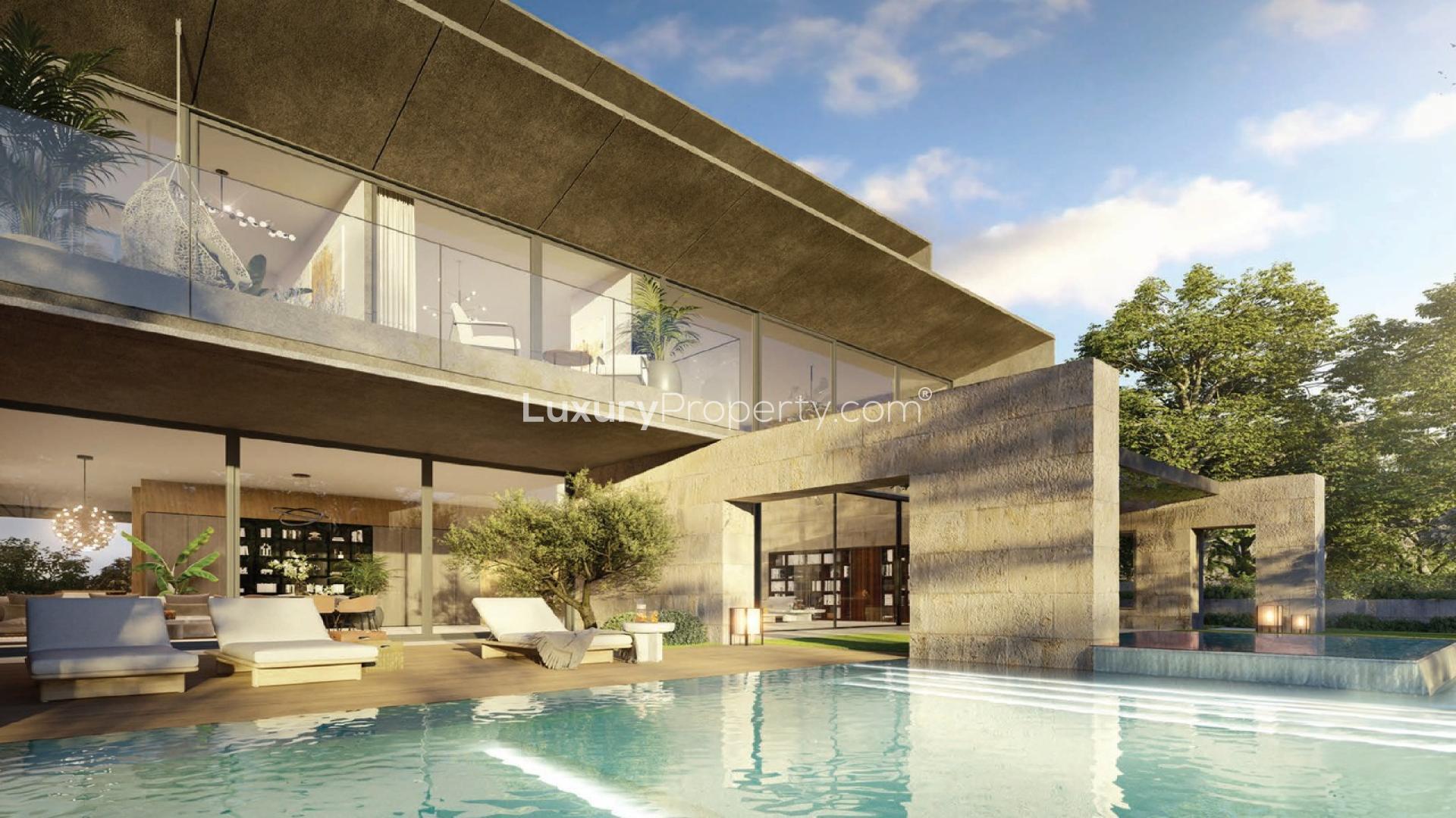 Luxurious living room in Tilal Al Ghaf villa with elegant decor and large windows