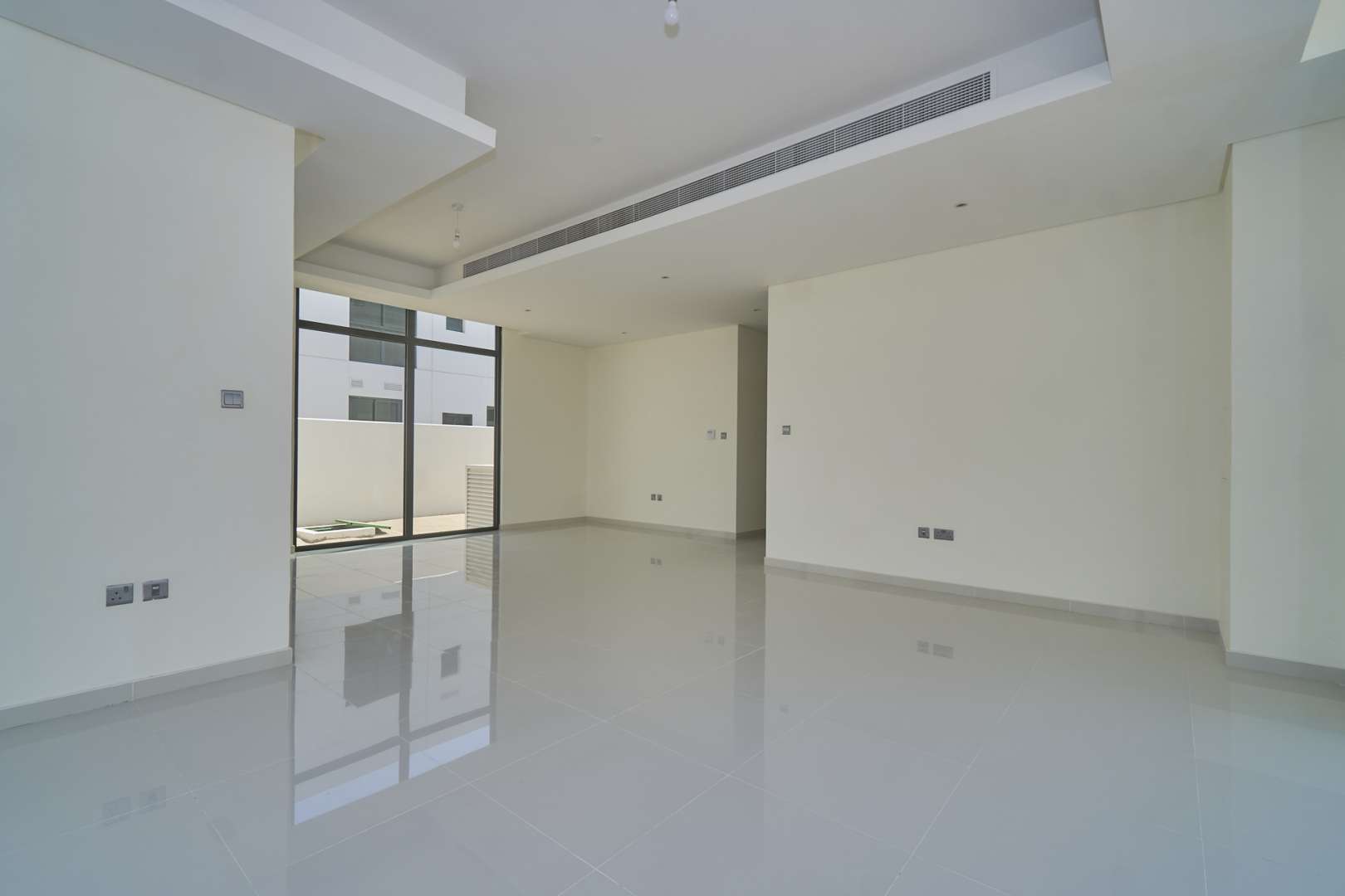 "Bright living area with large windows in six-bedroom villa, Primrose, Damac Hills 2.","Spacious living area in six-bedroom villa, Primrose, Damac Hills 2, for sale.","Spacious living area in six-bedroom villa, Primrose, Damac Hills 2, Akoya community.",Modern kitchen in six-bedroom villa, Primrose, Damac Hills 2, Akoya community, for sale