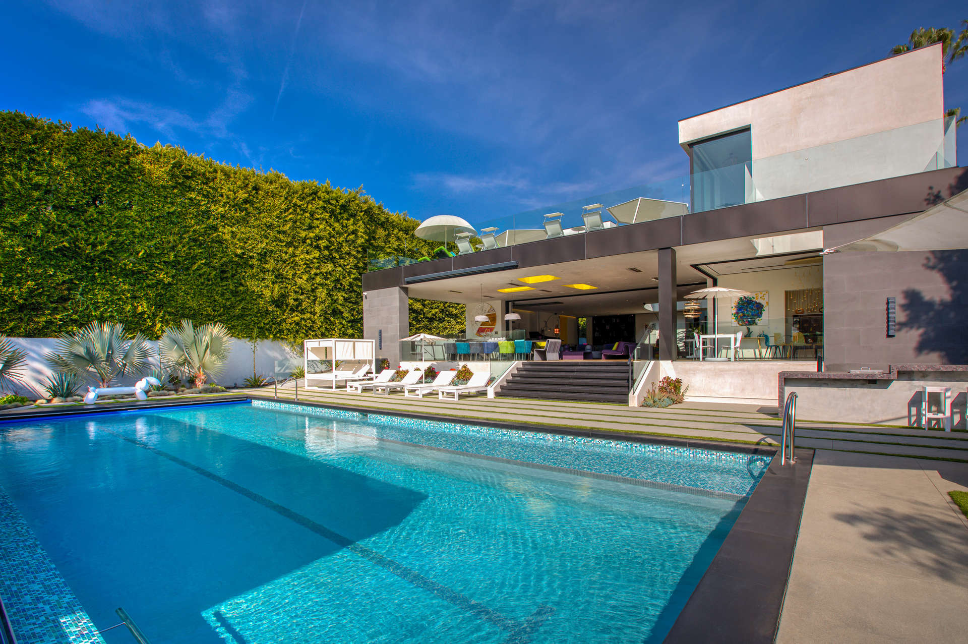 Contemporary Beverly Hills villa with pool, outdoor seating, and modern design for sale