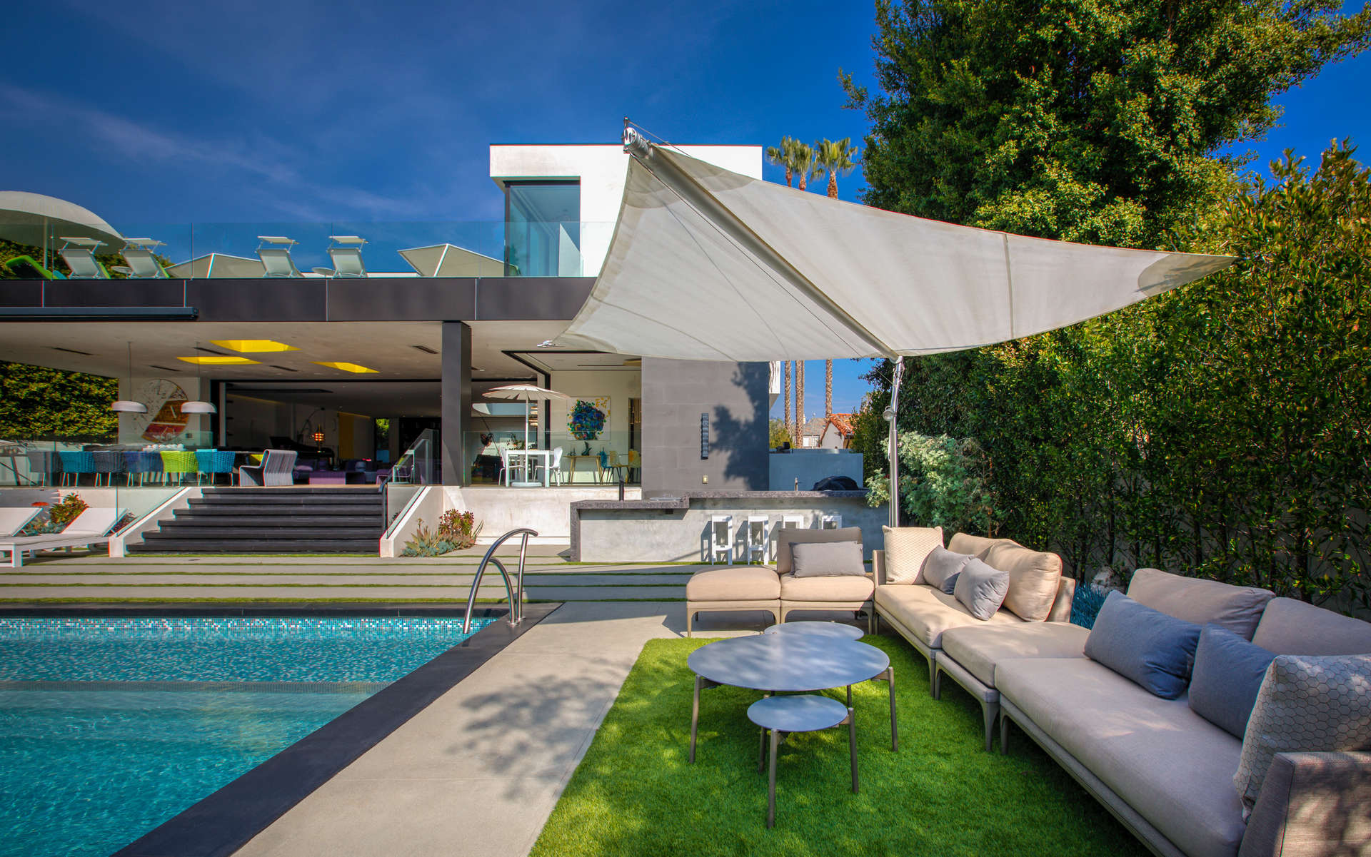 Luxurious villa with modern pool and outdoor seating in Beverly Hills, California