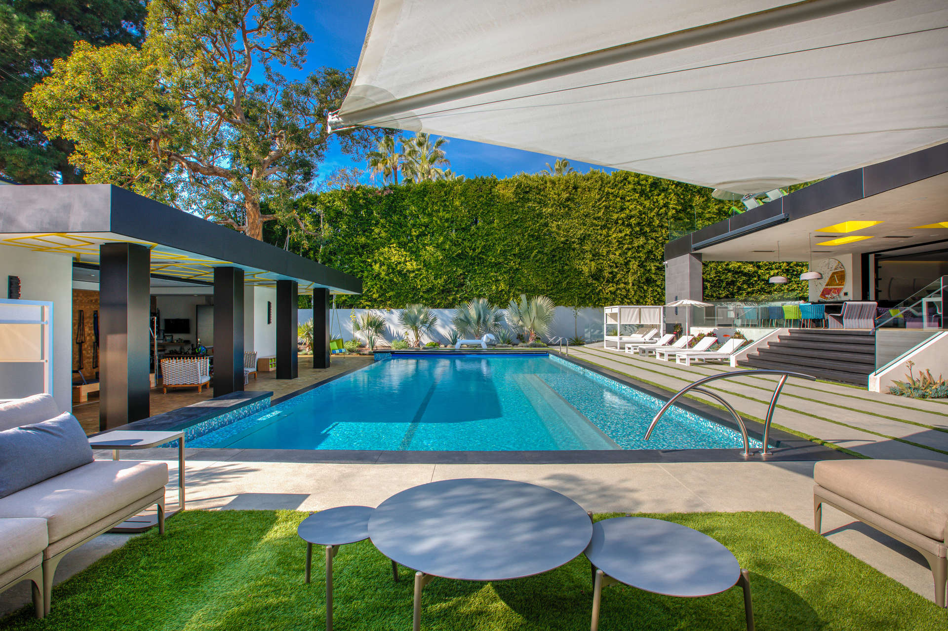 Luxurious villa with pool in Beverly Hills, California, featuring modern architecture and outdoor seating