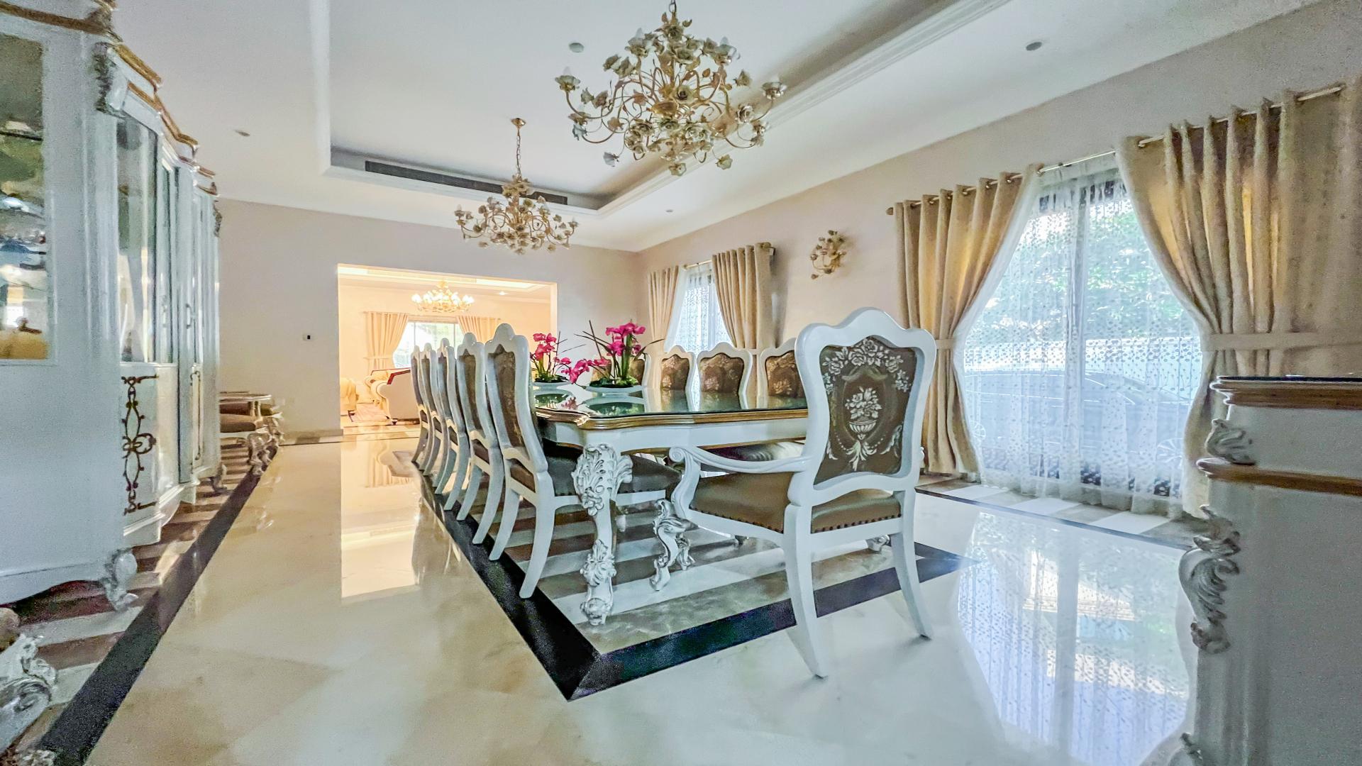 Luxurious living room in 6-bedroom villa, Emirates Hills, Sector E, elegant furnishings and decor