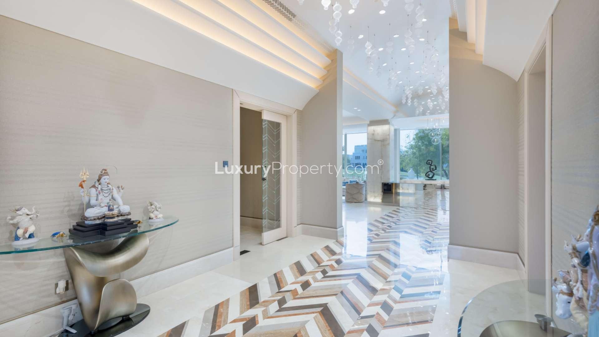 Spacious patio with garden view at 6-bedroom villa in Emirates Hills, Sector H