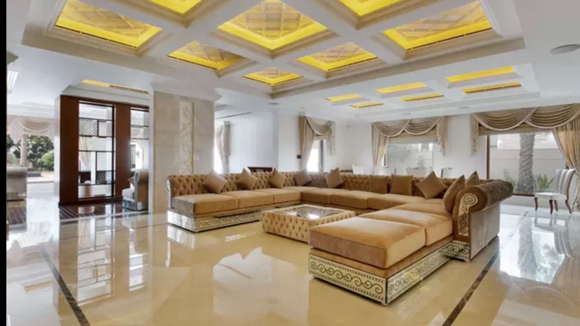 Luxurious entrance hall in 6-bedroom villa, Emirates Hills, featuring grand staircase and elegant decor