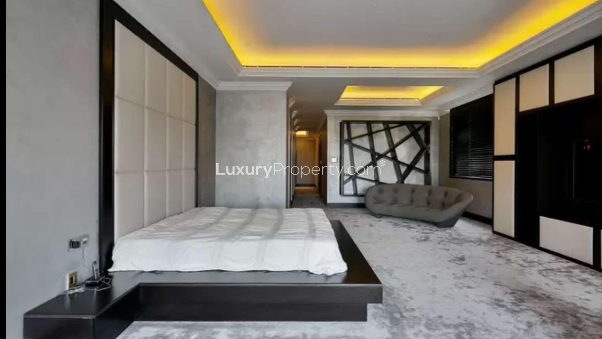 Luxurious living room in 6-bedroom Emirates Hills villa with elegant decor and spacious seating