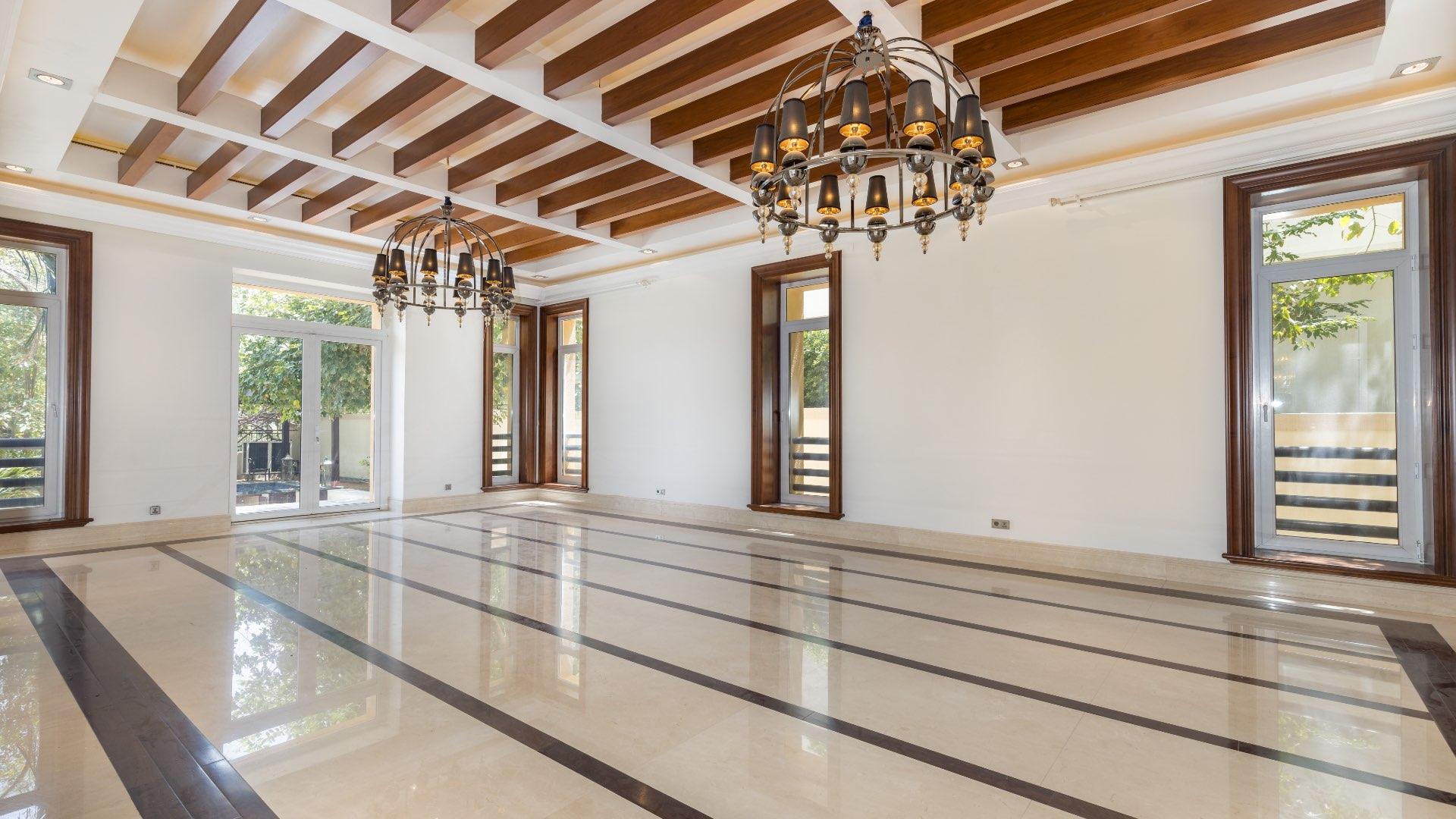 Elegant living room with chandeliers in six-bedroom villa, Emirates Hills, Sector P