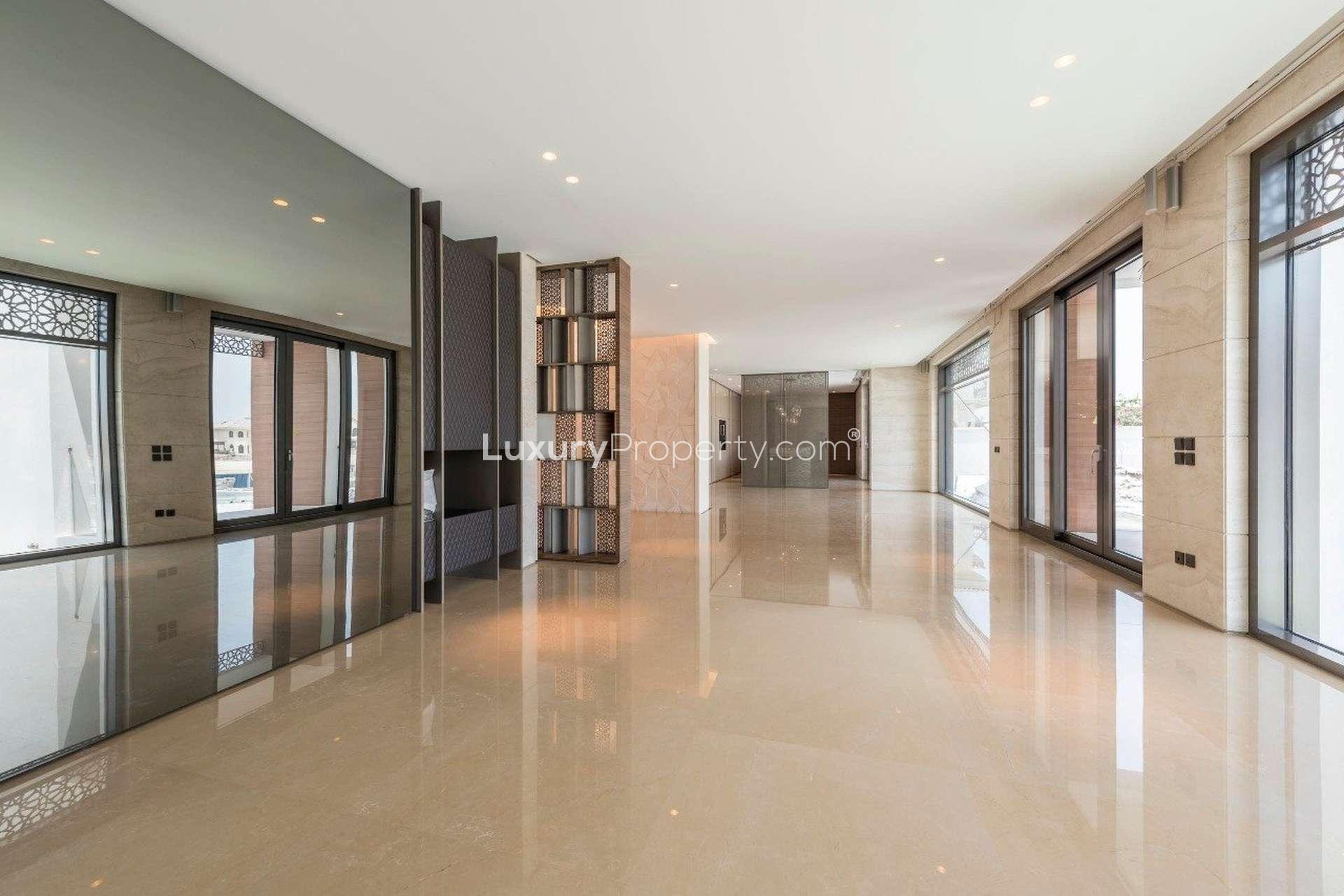 Luxurious interior of six-bedroom villa in Palm Jumeirah, featuring elegant chandelier and decor