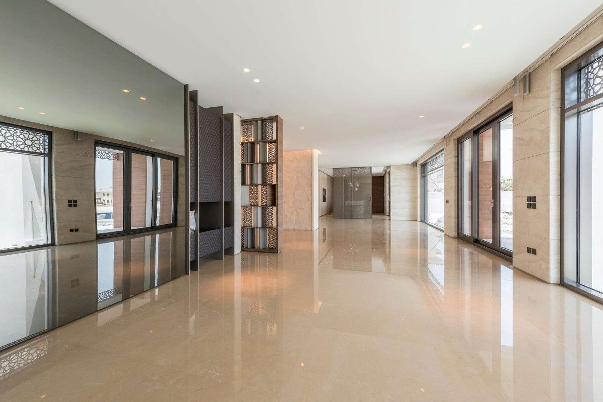 Luxurious interior of six-bedroom villa in Palm Jumeirah, featuring elegant chandelier and decor