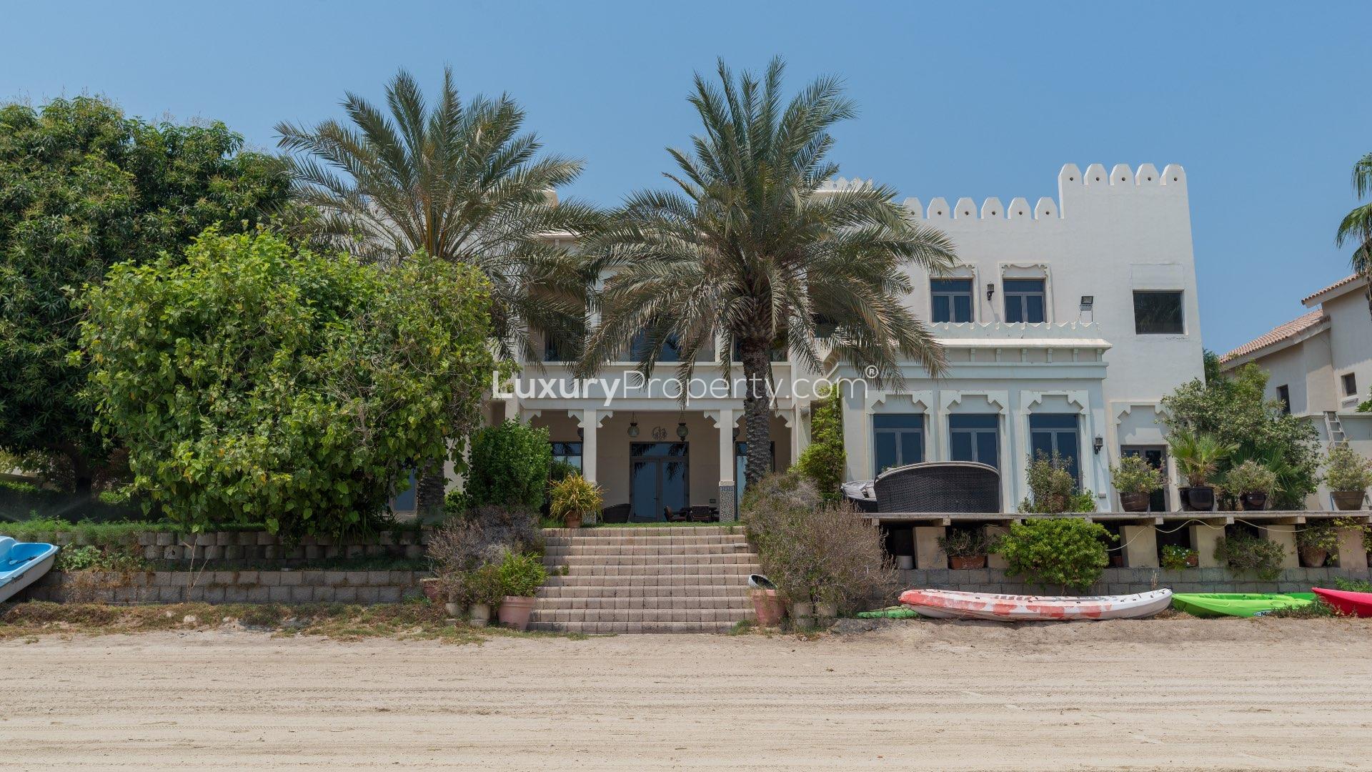 "Elegant 6-bedroom villa exterior with garage, Palm Jumeirah Signature Villas, for sale.","Luxurious 6-bedroom villa exterior, Palm Jumeirah, Signature Villas, beachfront view, for sale.","Luxury 6-bedroom villa with pool, Palm Jumeirah, Signature Villas, for sale, LP06946.",Luxurious living room in Palm Jumeirah villa with ornate ceilings and elegant decor