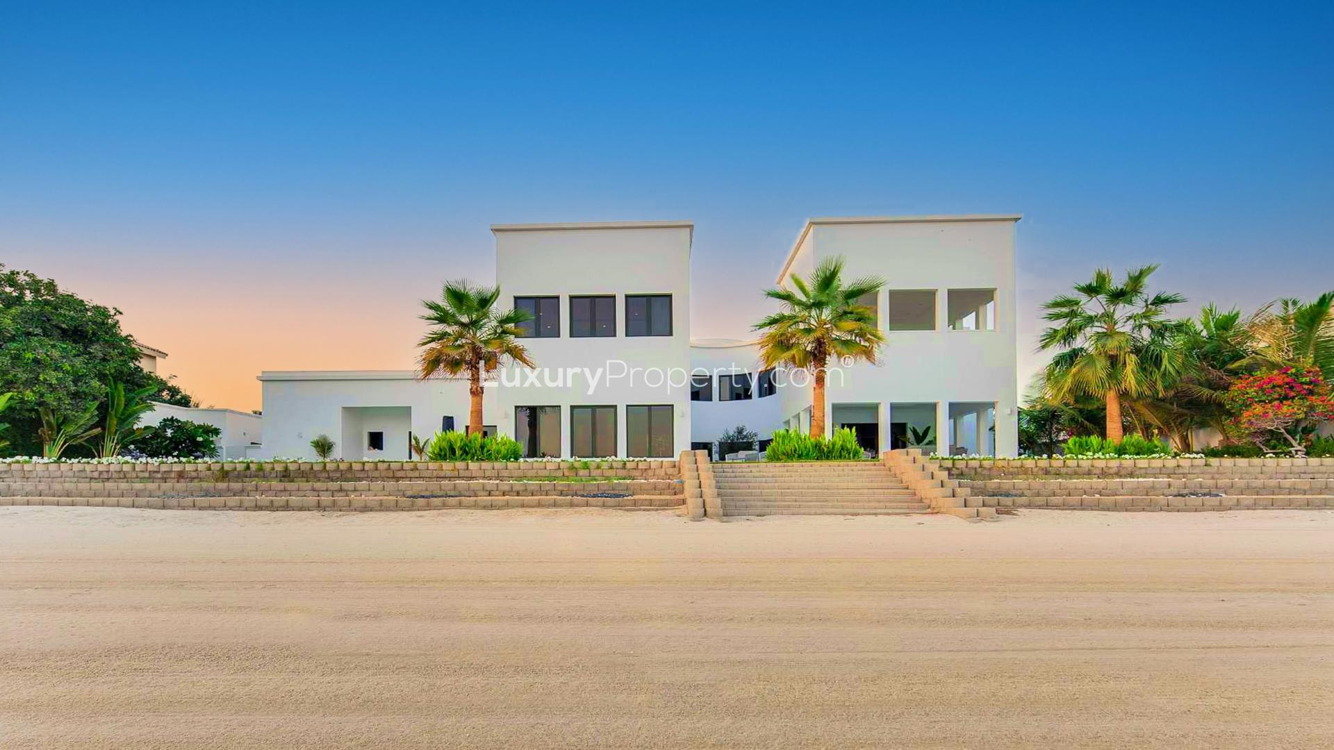 Luxurious Palm Jumeirah villa pool with stunning waterfront and skyline views at sunset