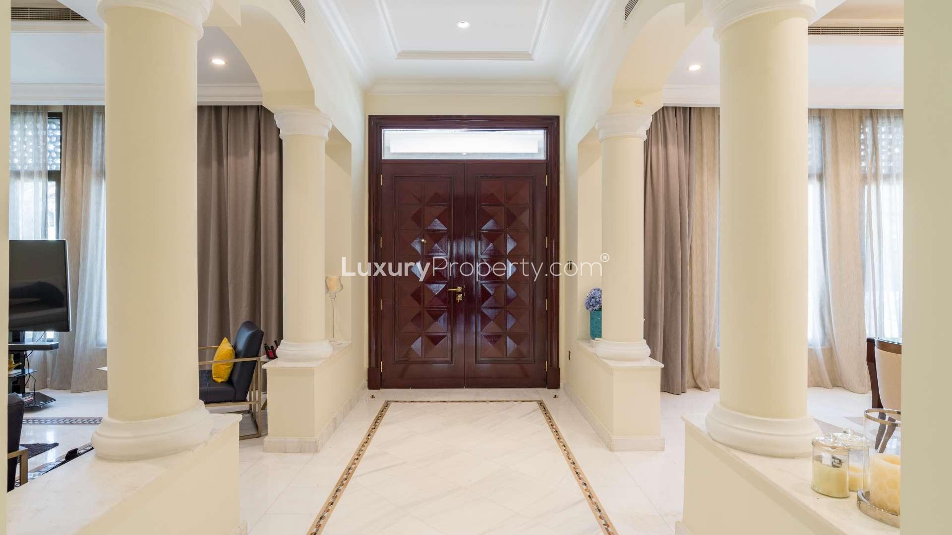 Luxurious living room in Palm Jumeirah villa with modern decor and elegant furnishings