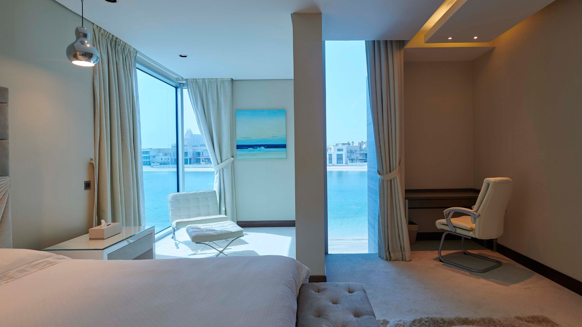 Luxurious Palm Jumeirah villa bedroom with stunning beachfront view and modern decor