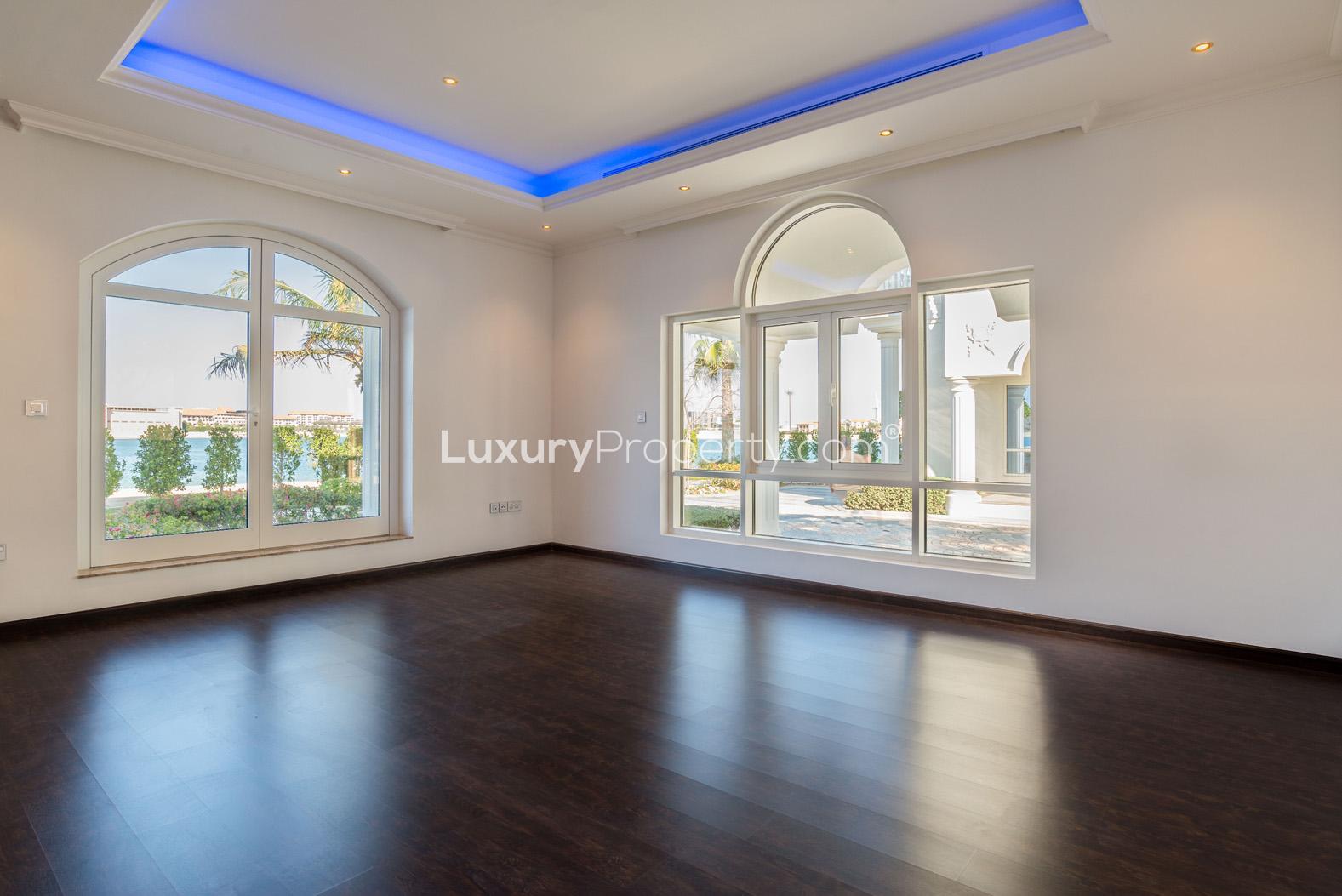 Palm Jumeirah Signature Villa exterior with lush greenery and elegant architecture for sale