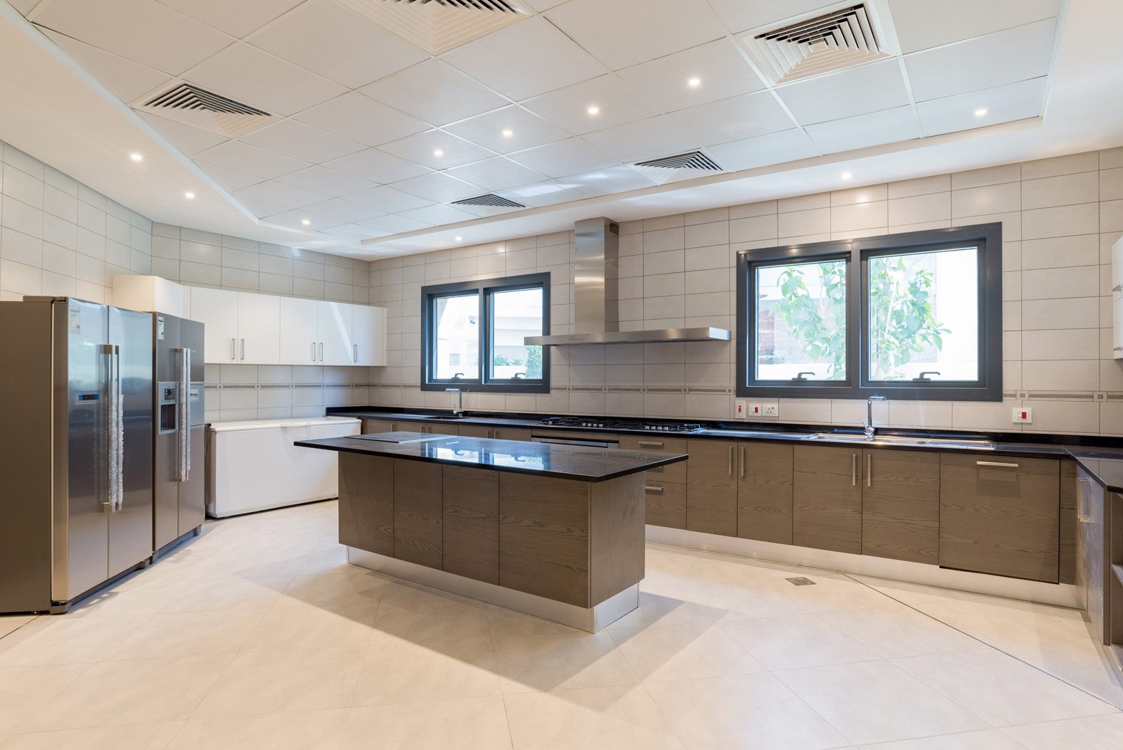 Modern kitchen in luxury 6-bedroom villa, Palm Jumeirah, with sleek appliances and island counter