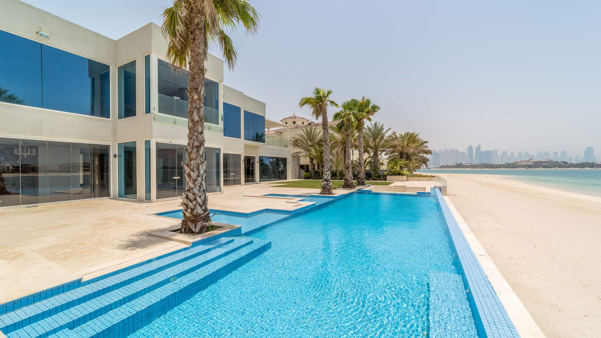 Upgraded 6-bedroom villa with palm trees, located in Palm Jumeirah's Signature Villas community