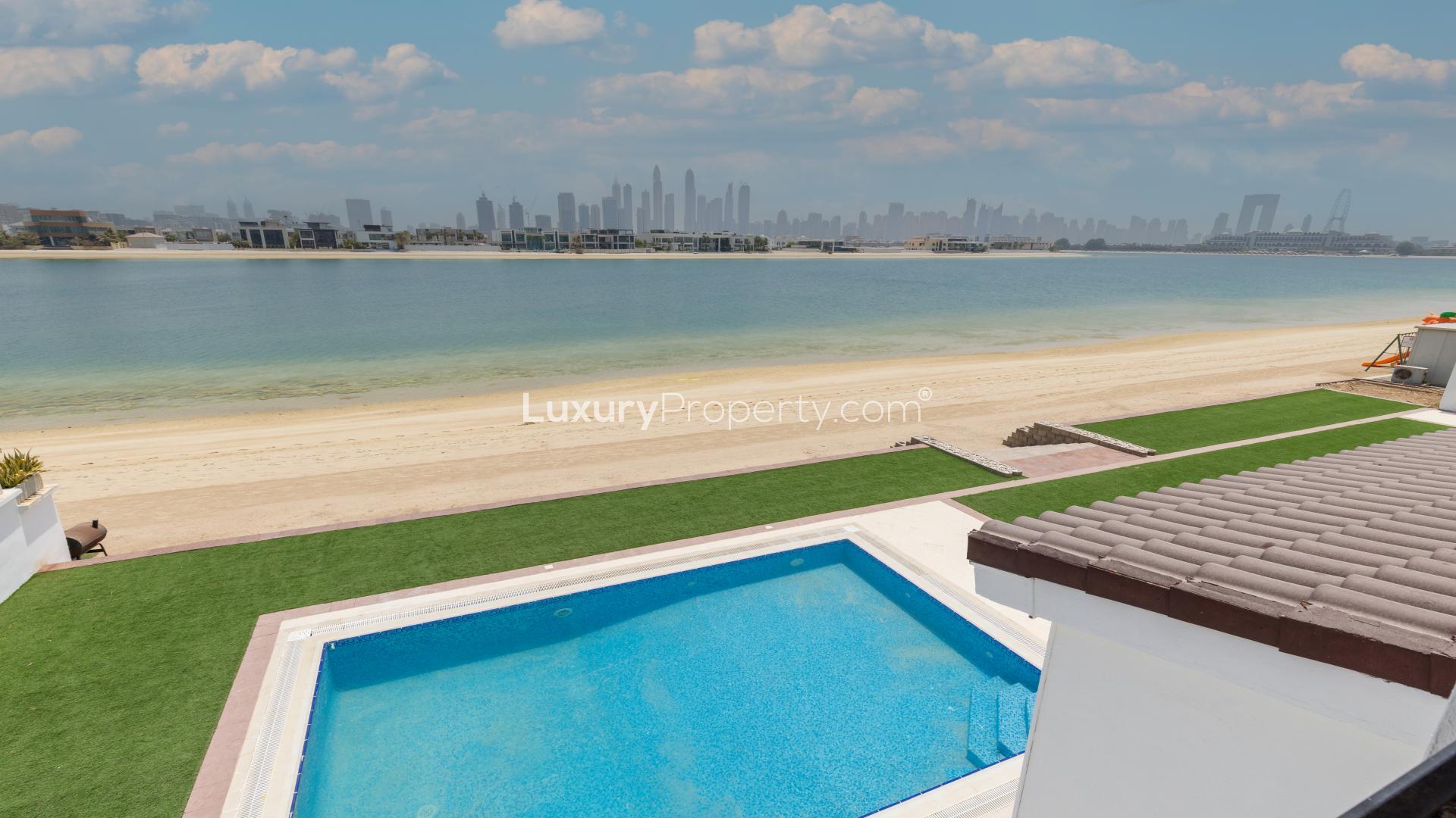 Palm Jumeirah villa with pool, beach access, and Marina skyline view
