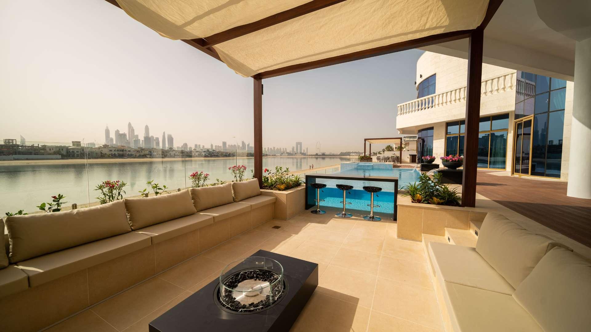 Luxurious villa patio with pool and skyline view on Palm Jumeirah, Dubai