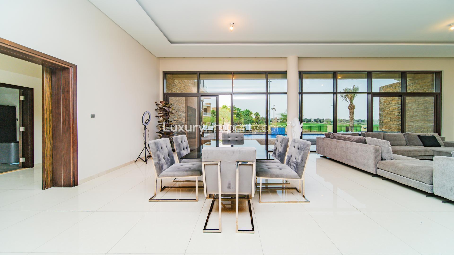 Luxurious villa living room with large sofa and modern decor in Damac Hills