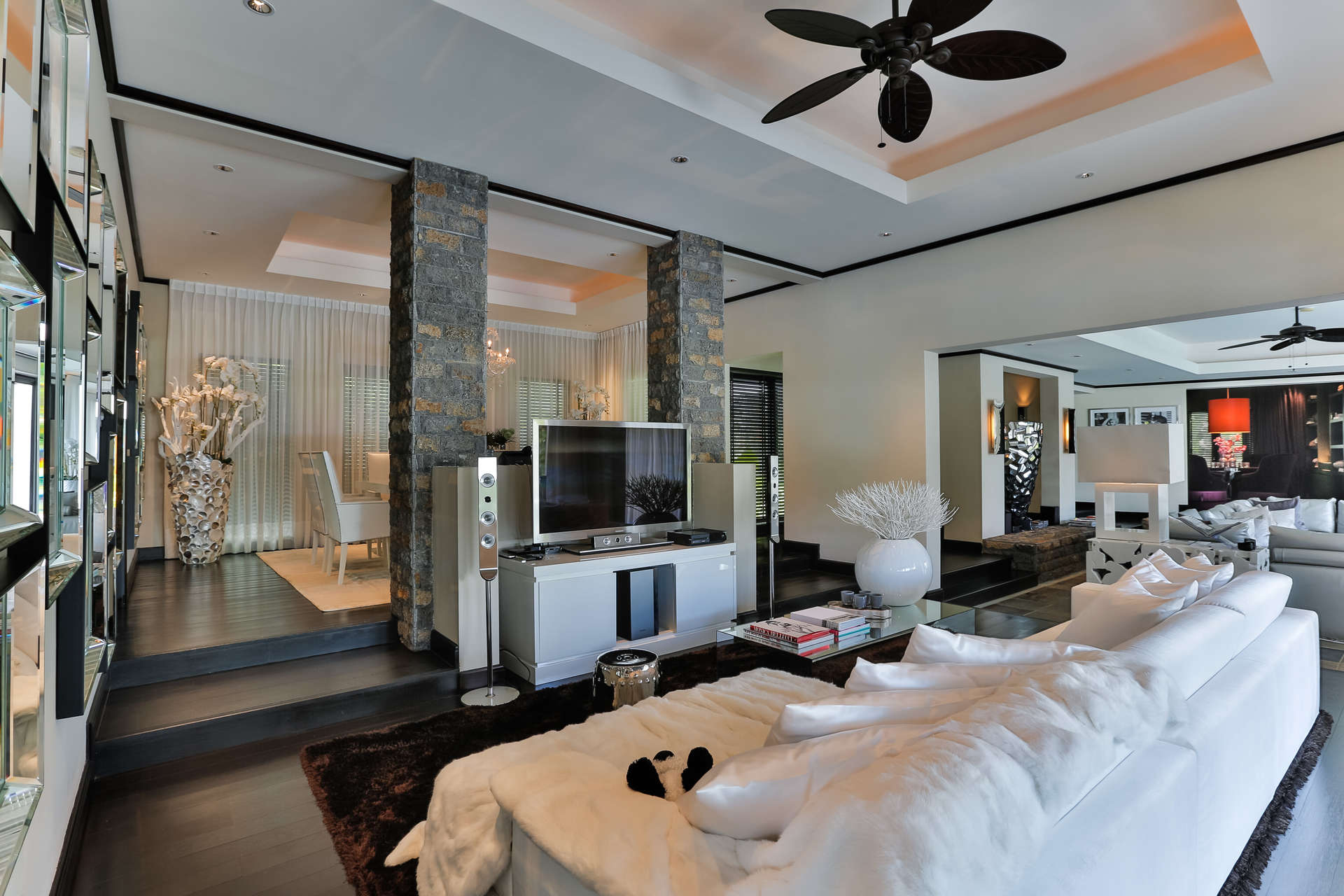 Luxurious living room in 6-bedroom villa, Anahita, Mauritius with modern decor and plush seating