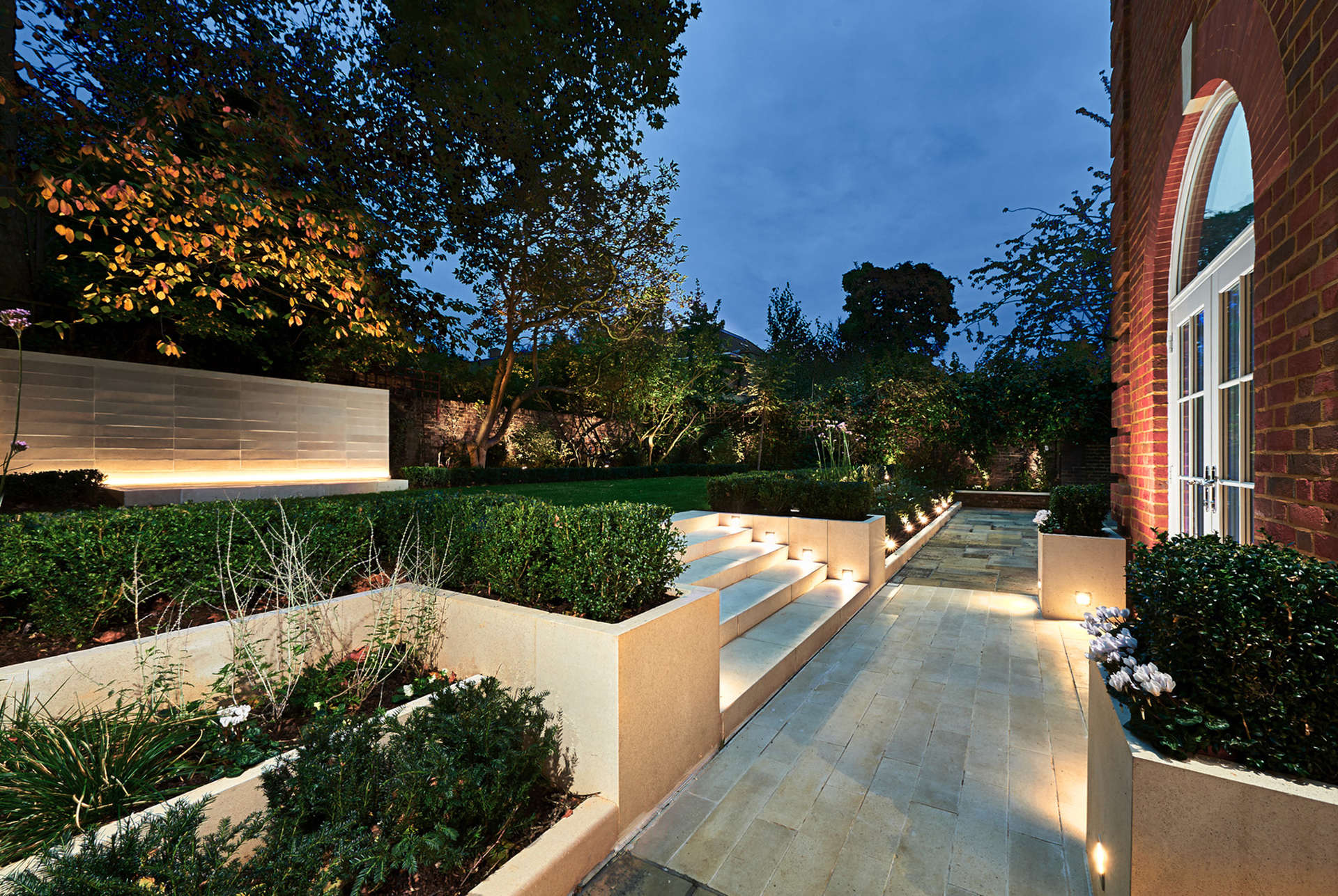 Elegant villa exterior on Acacia Road, St. John's Wood, London, with lush garden
