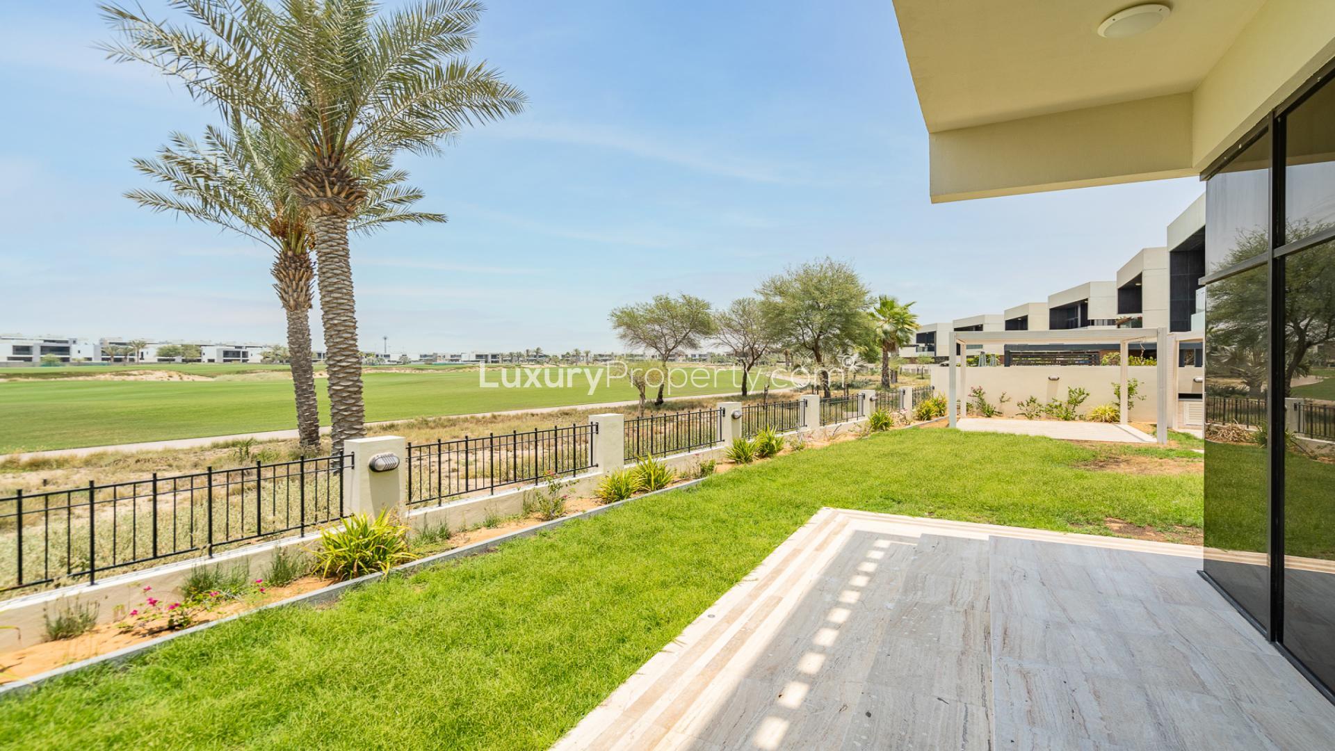 Modern single row villa exterior in Damac Hills, The Field, with spacious driveway