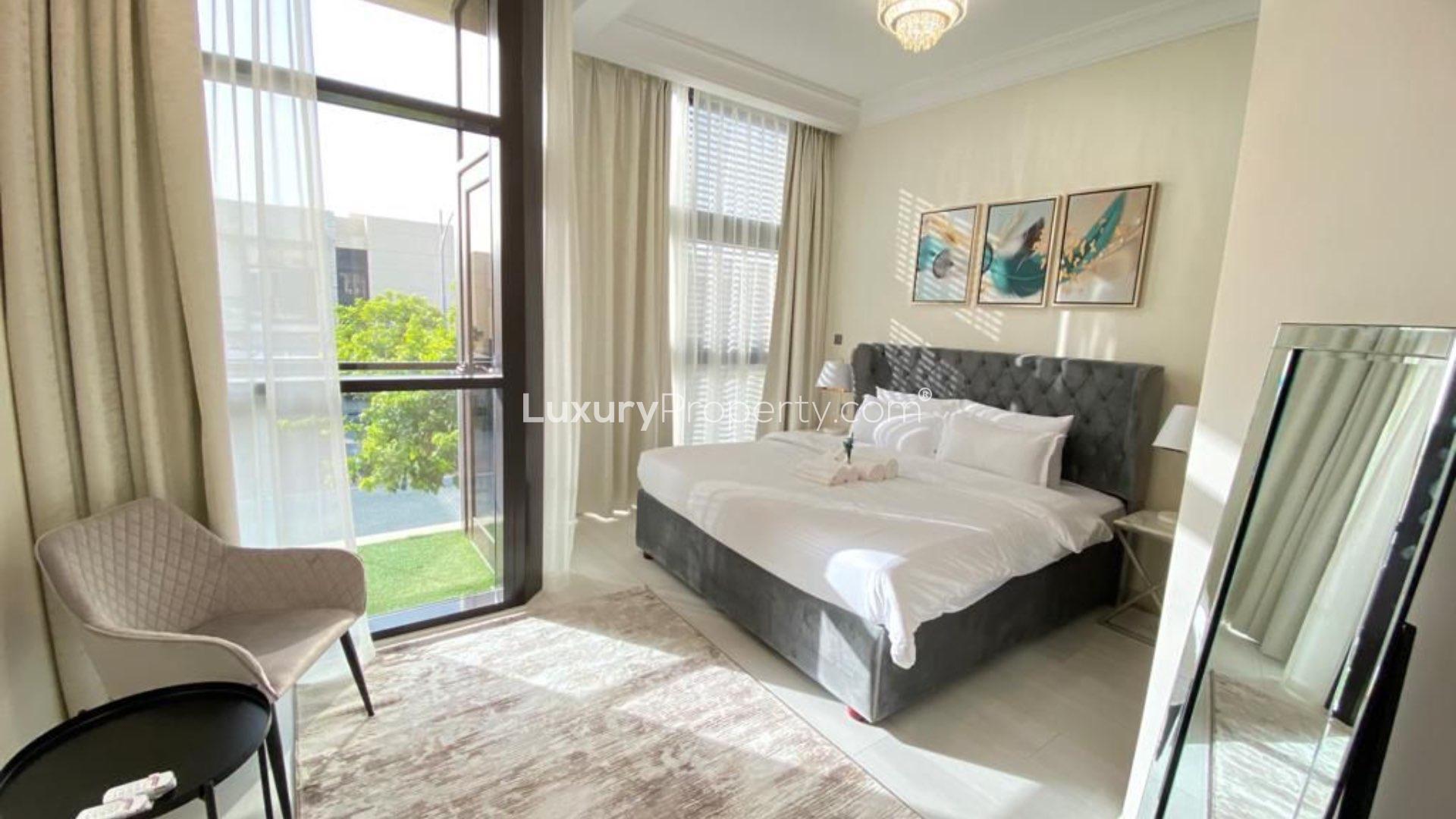 Dining area in fully furnished villa, Damac Hills, The Field, with elegant decor and lighting