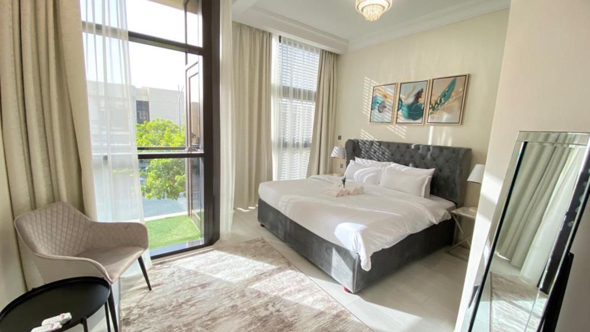 Dining area in fully furnished villa, Damac Hills, The Field, with elegant decor and lighting