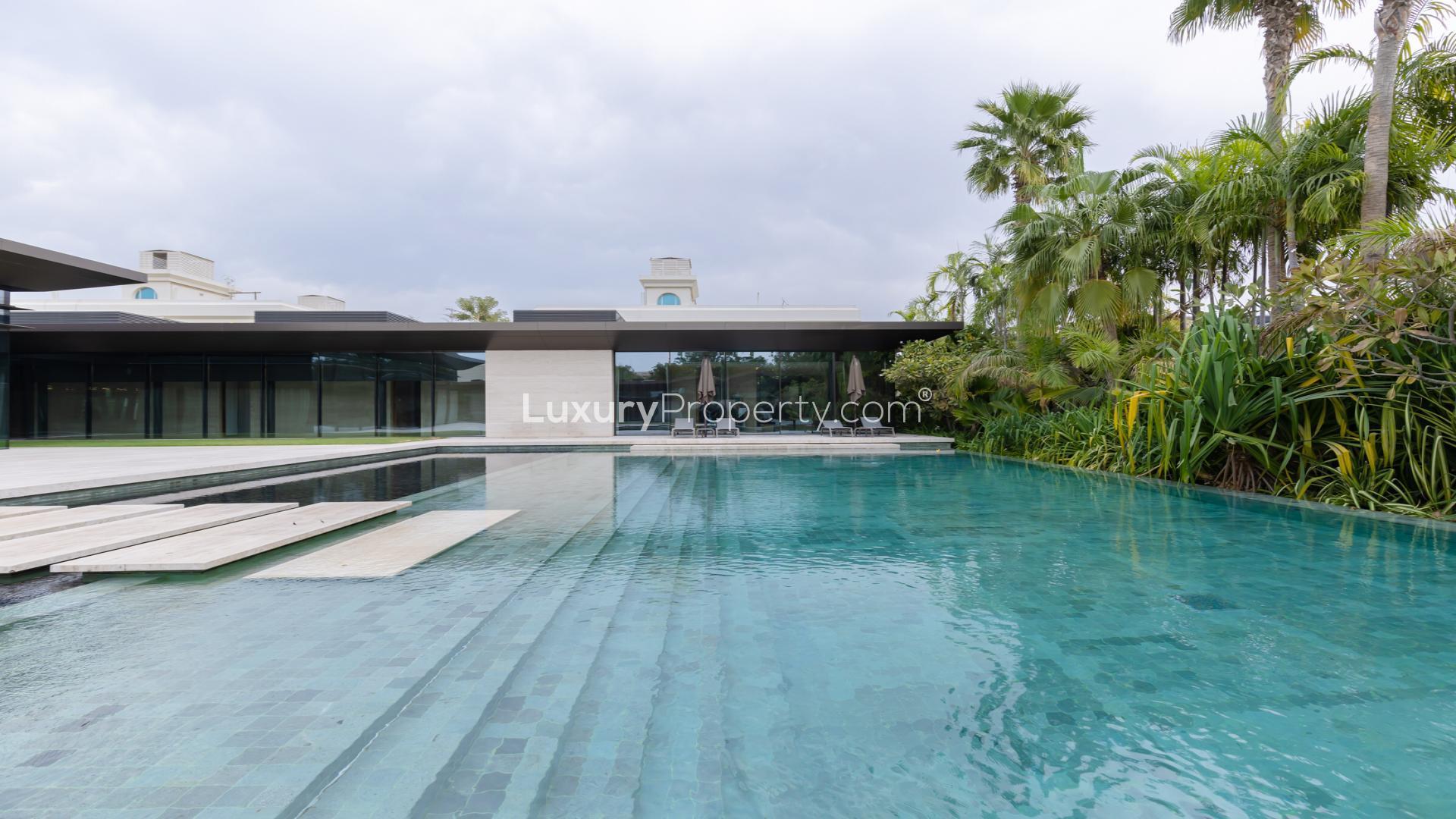 N/A,Luxurious villa pool with lush garden in Umm Suqeim 1, Dubai