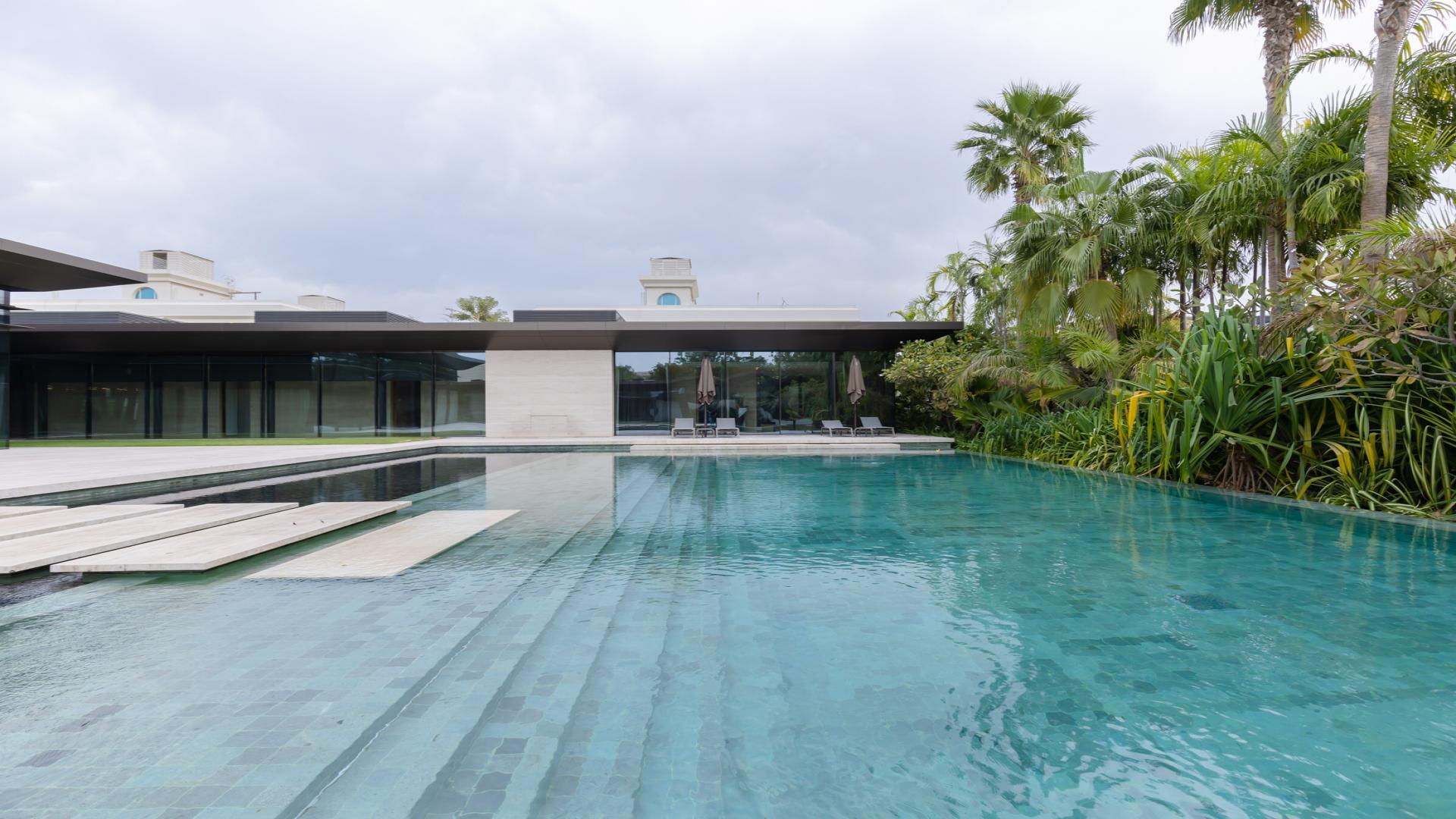 N/A,Luxurious villa pool with lush garden in Umm Suqeim 1, Dubai