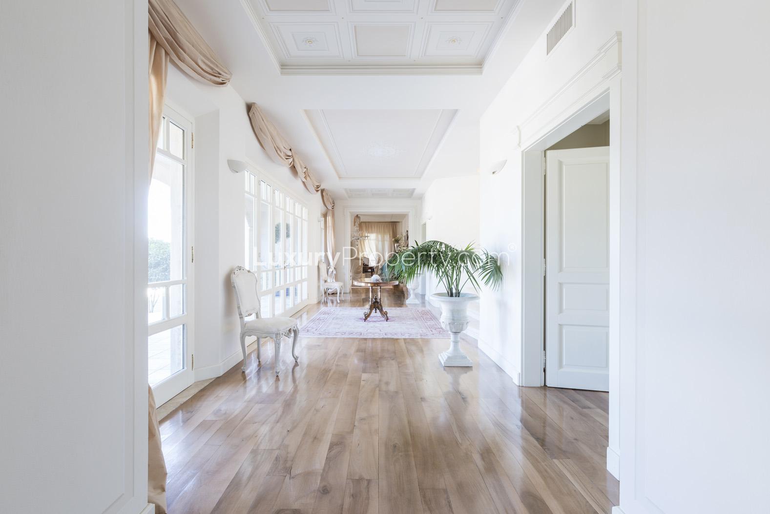 Elegant hallway with large windows in Villa Bianco Chic, Florence residence