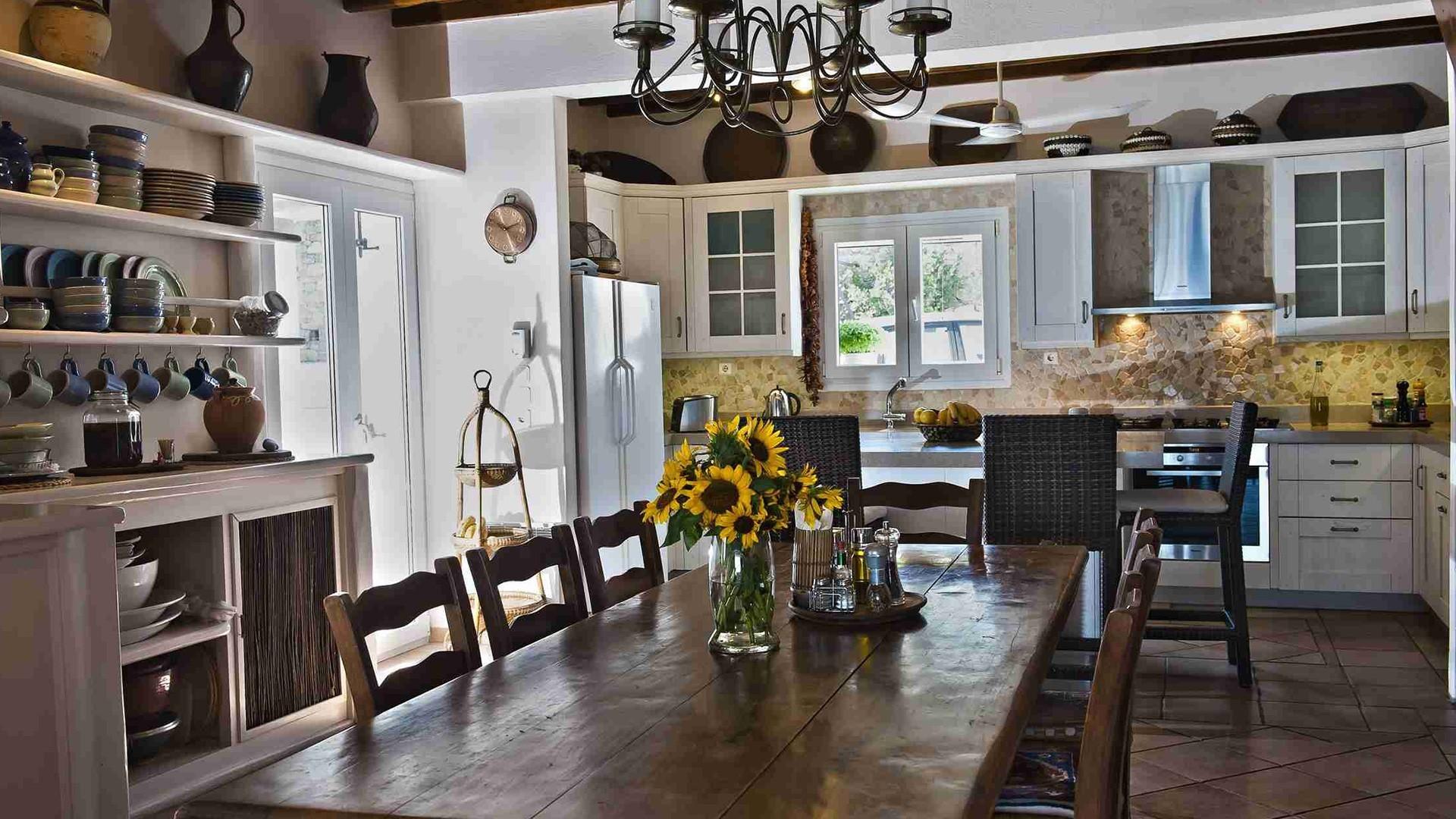 Stone terrace with sea view at dusk, Villa Hurmuses, Mykonos