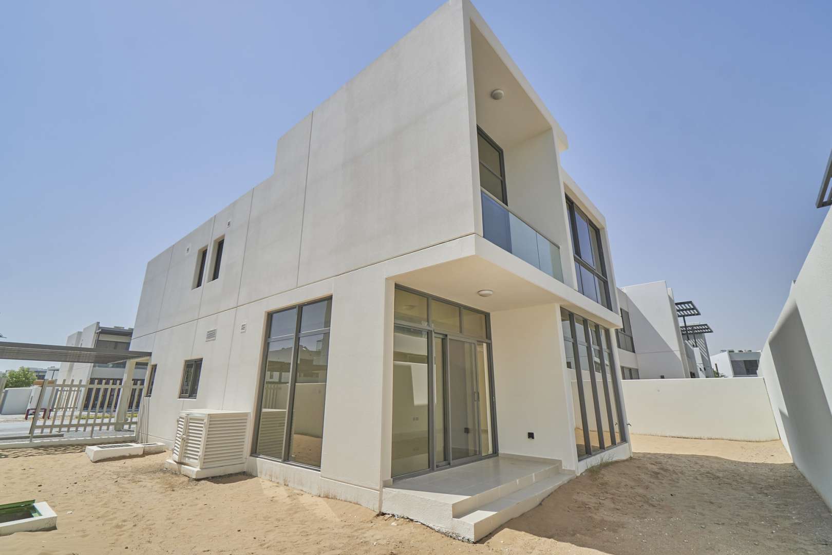 Six-bedroom villa exterior in Zinnia, Damac Hills 2, with modern design and spacious driveway