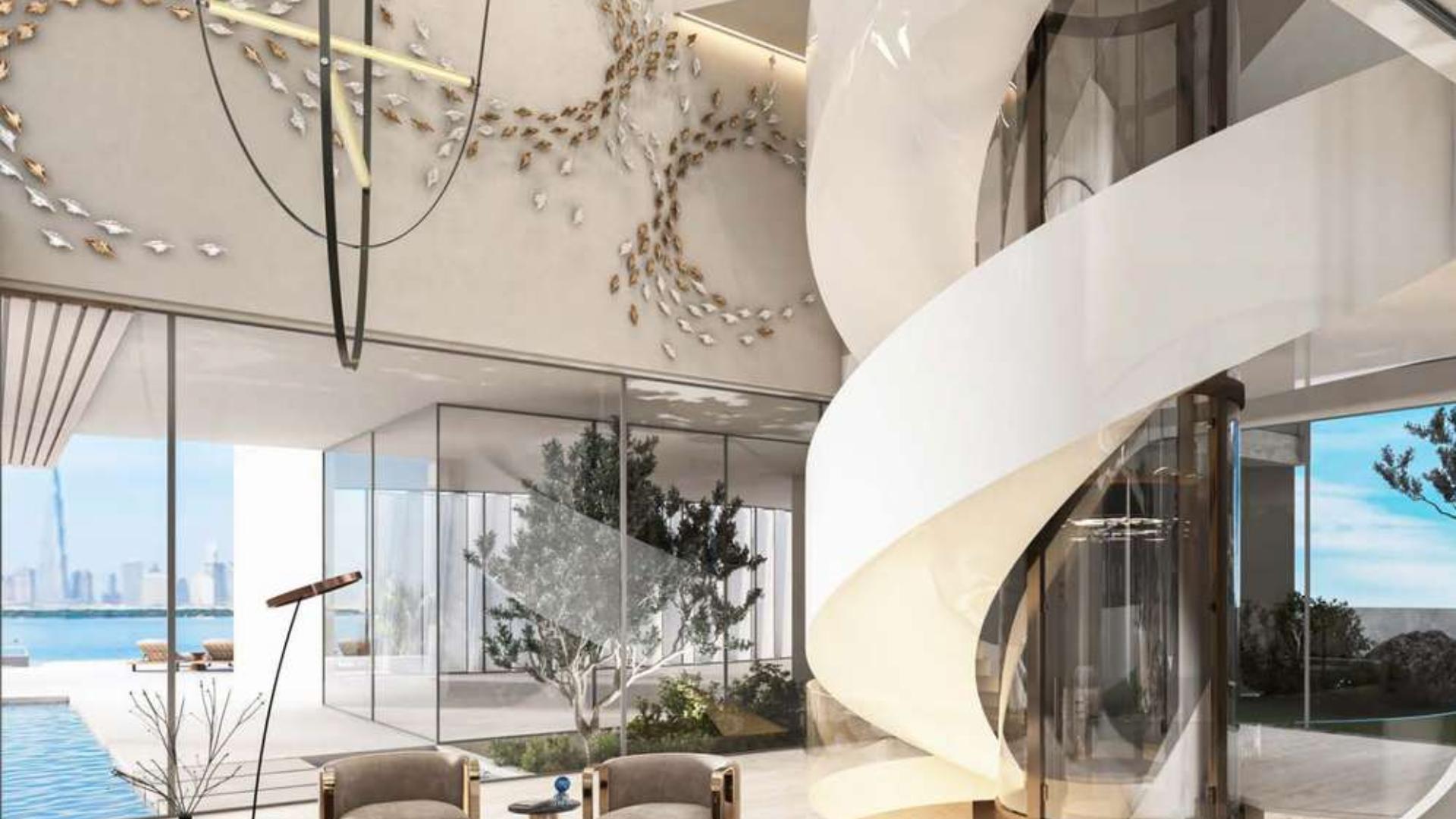 Contemporary villa interior with spiral staircase and skyline view, The World Islands