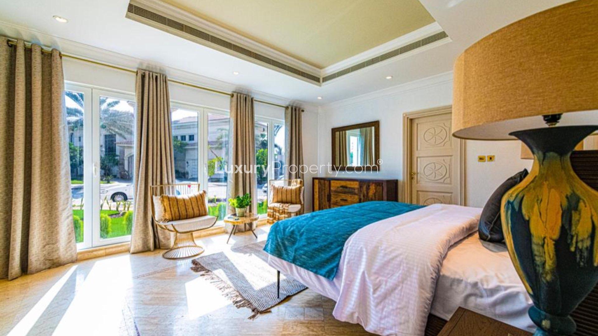 Furnished villa with palm trees, elegant steps, and skyline view in Palm Jumeirah