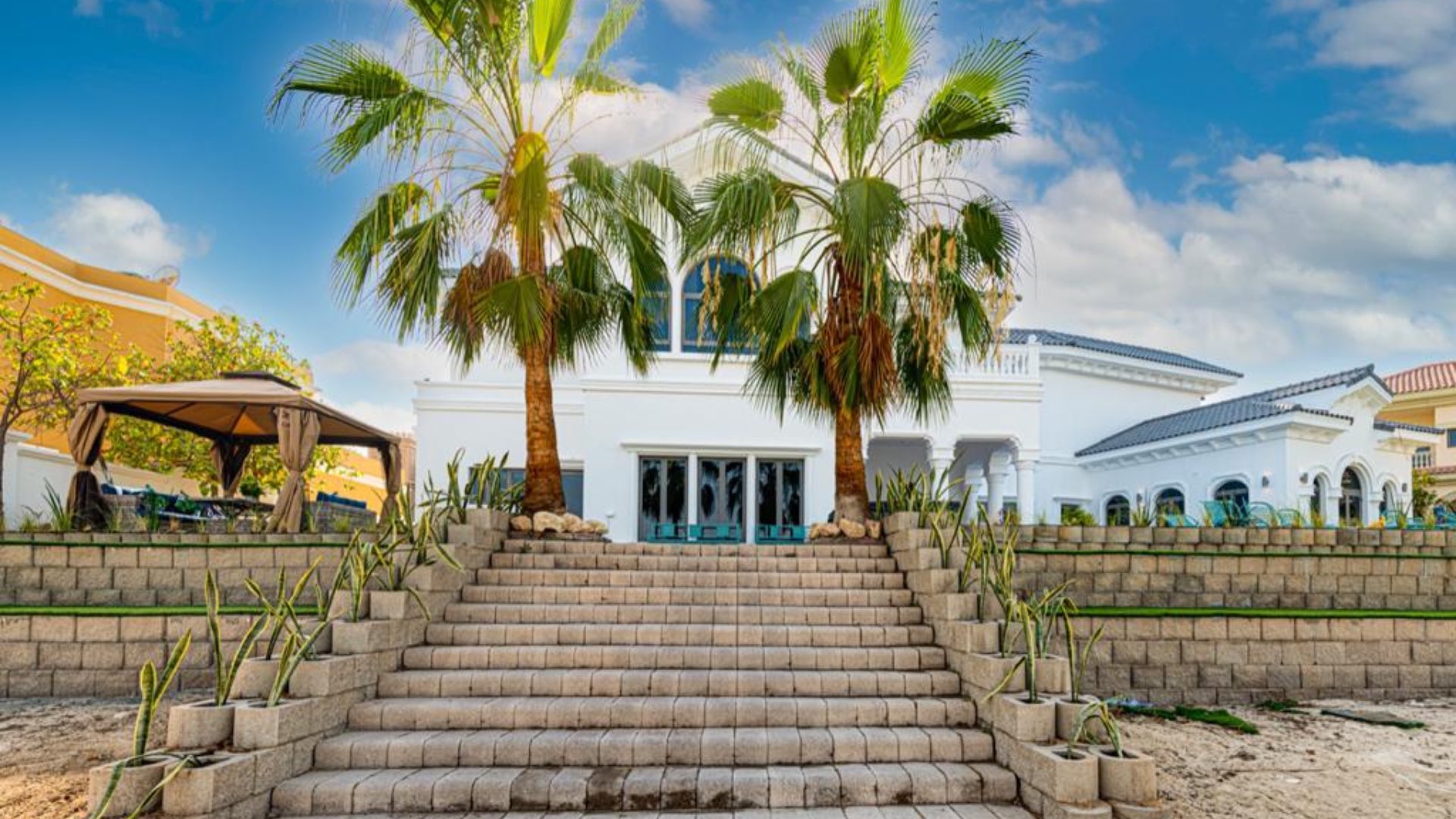 Furnished villa patio with pool view in Palm Jumeirah Signature Villas, short-term rental