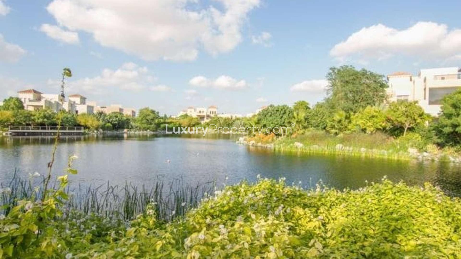 Luxurious poolside view of 7-bedroom Silk Leaf Villa in Al Barari, Dubai for sale