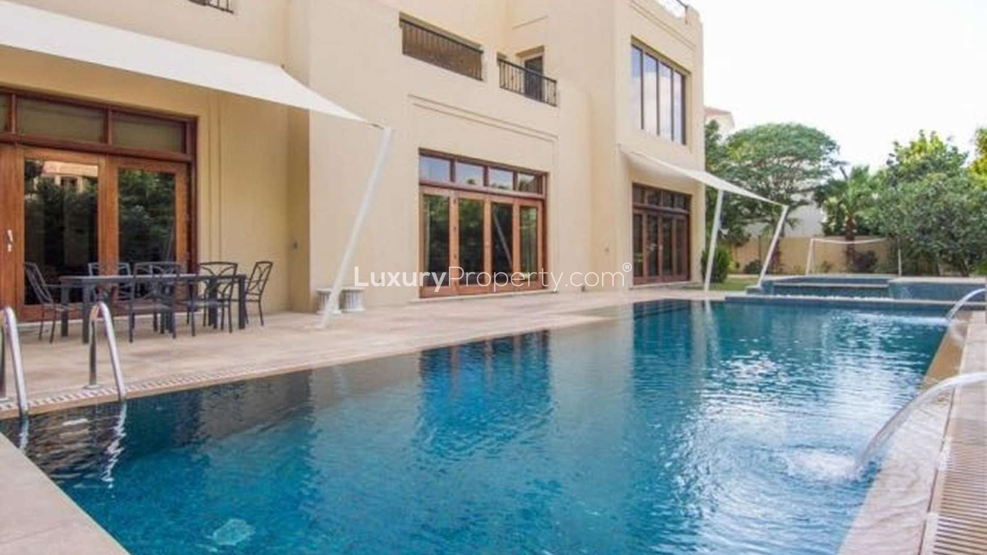 Luxurious poolside view of 7-bedroom villa in Al Barari, perfect for rent
