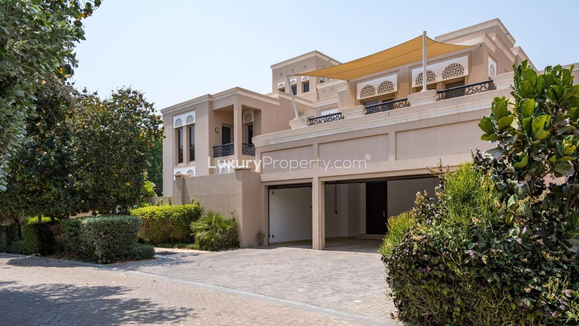Beautifully maintained 7-bedroom villa exterior with lush greenery in Al Barari for rent