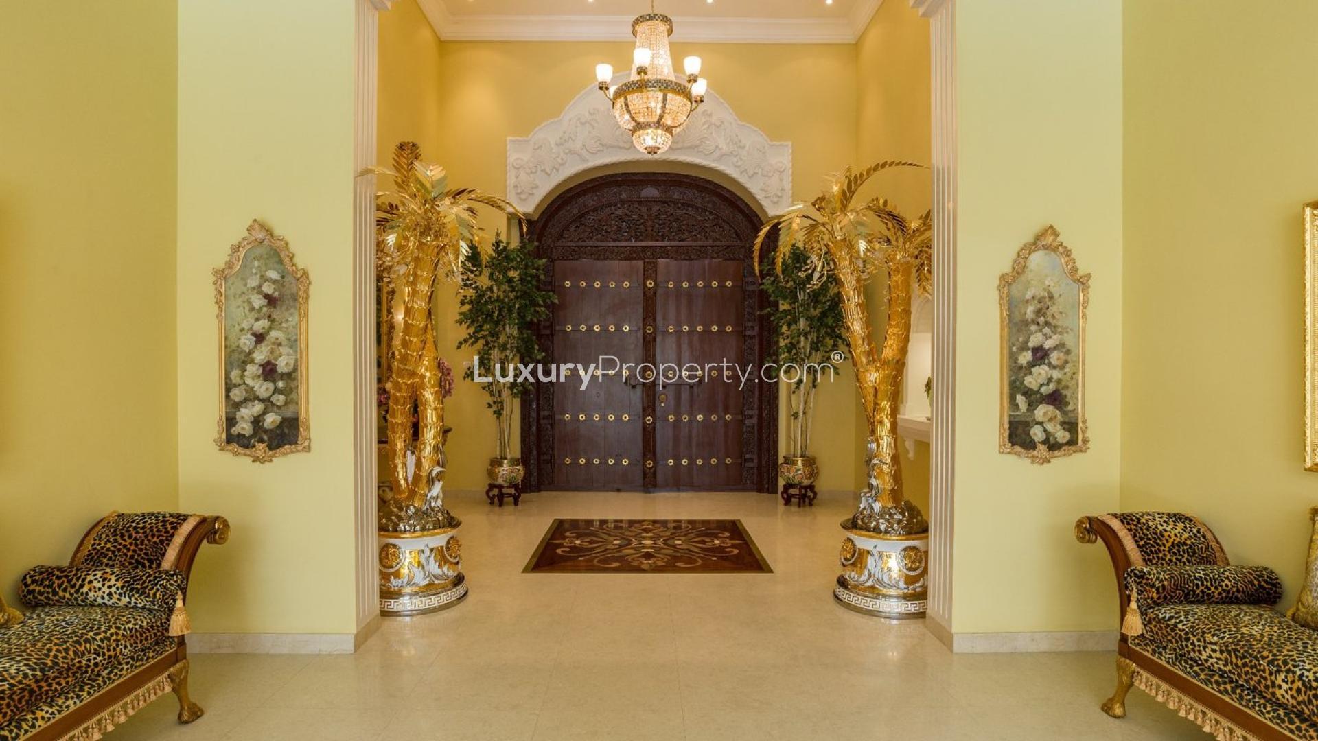 Luxurious villa entrance in Al Barsha with elegant Versace finishings and ornate decor
