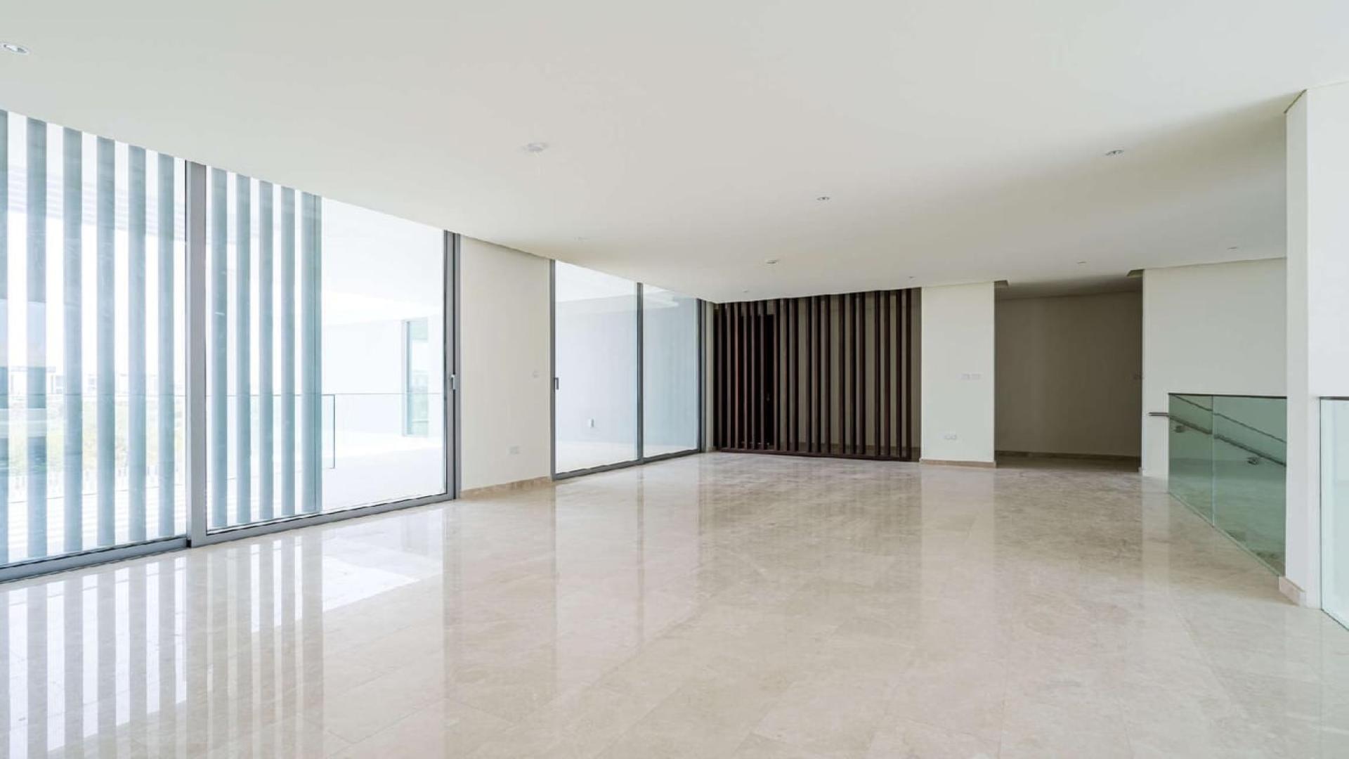 Luxurious living room in 7-bedroom villa at Dubai Hills Estate, modern decor and spacious layout