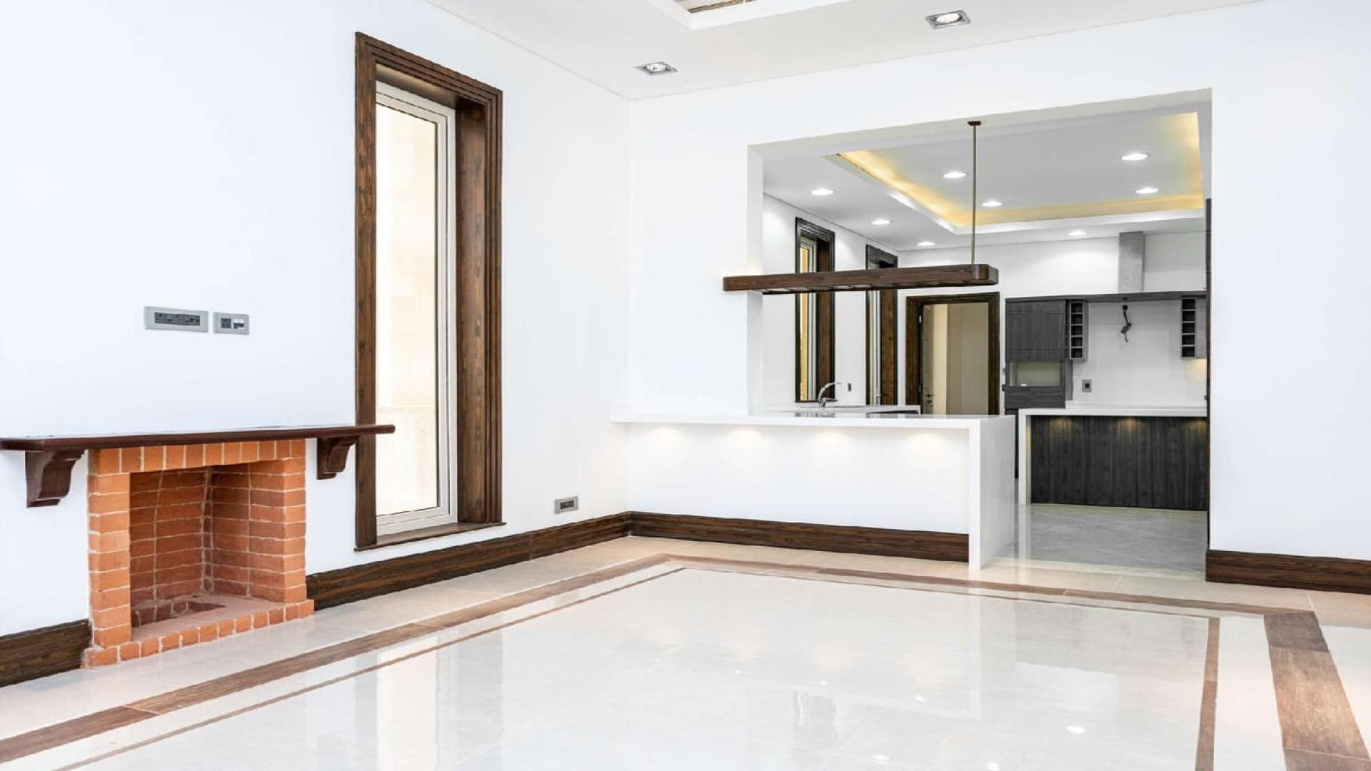 Elegant living area with fireplace in luxury Wildflower villa, Jumeirah Golf Estates