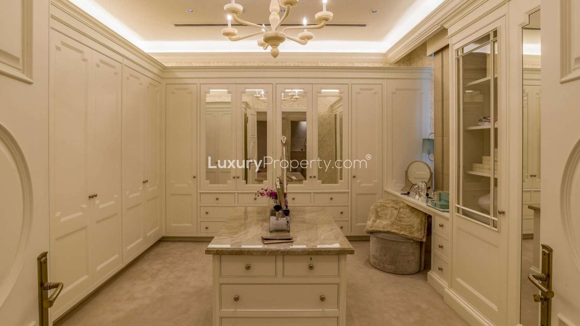 Elegant hallway with chandelier and staircase in Dubai Hills Grove seven-bedroom villa