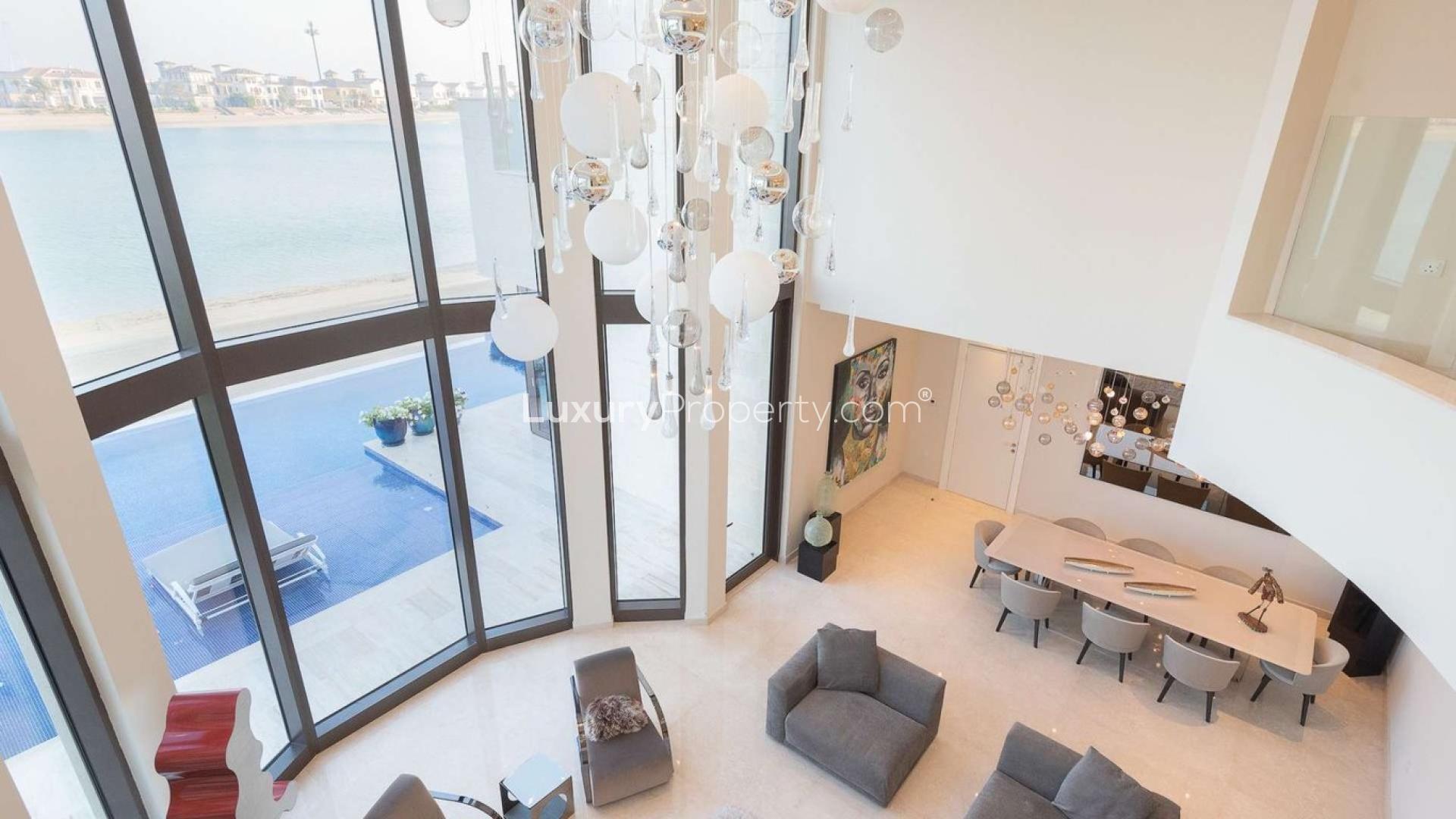 Spectacular 7-bed villa exterior on Frond J, Palm Jumeirah, with palm trees and modern design