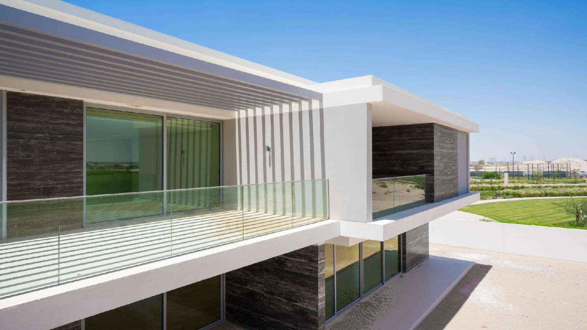 Bright, spacious living room in upgraded villa, Dubai Hills Estate, with golf course views