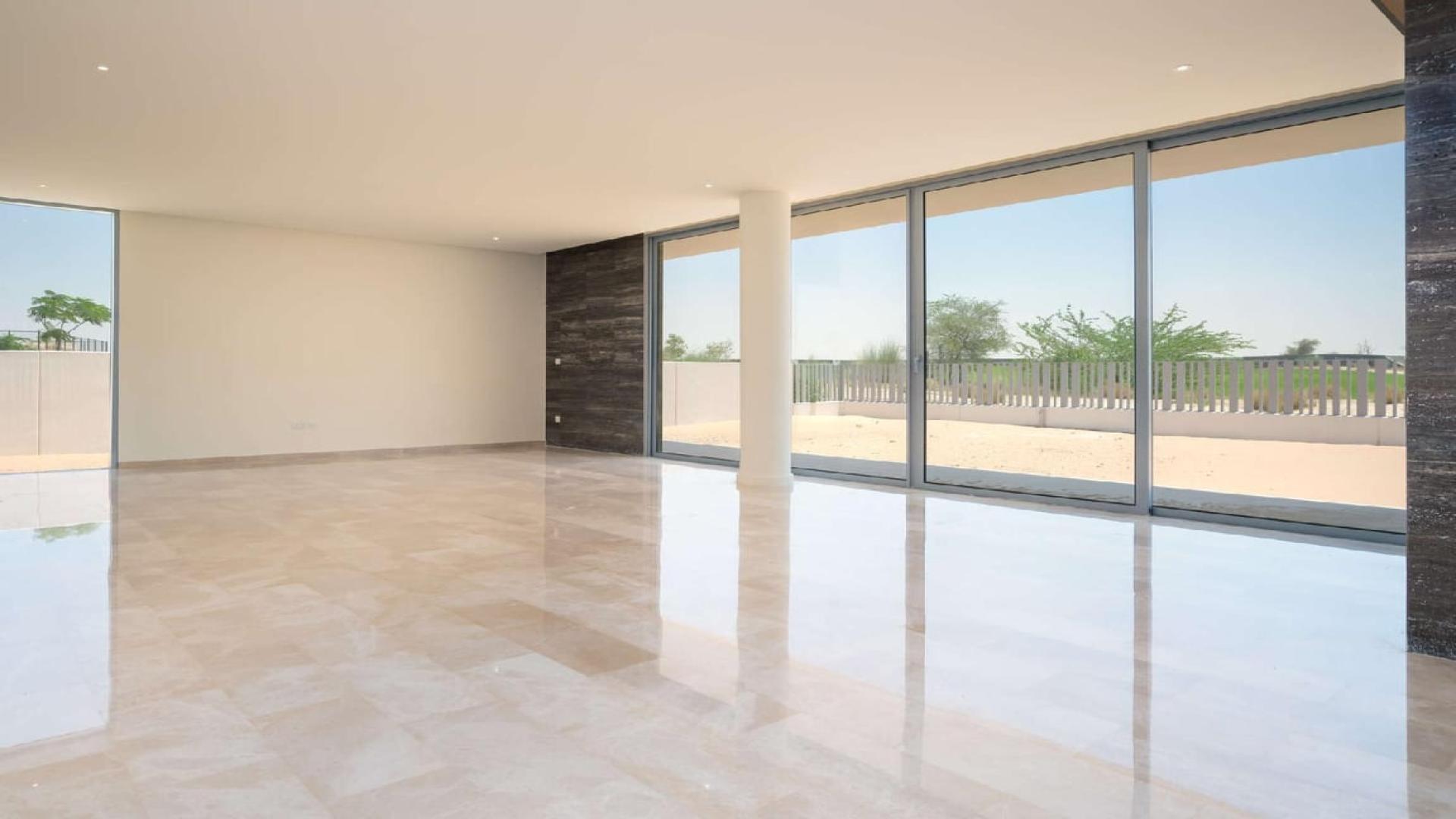 Bright, spacious living area with golf course view in Dubai Hills Estate villa for sale