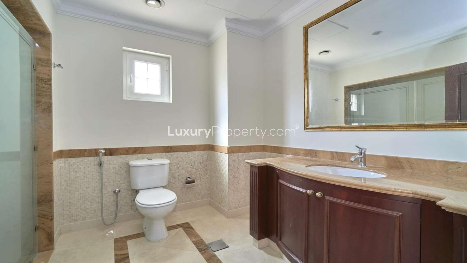 "Spacious living room with large windows in Emaar 6-bed villa, Arabian Ranches.",Luxurious bathroom in upgraded 6-bed villa, Polo Homes, Arabian Ranches, Emaar property